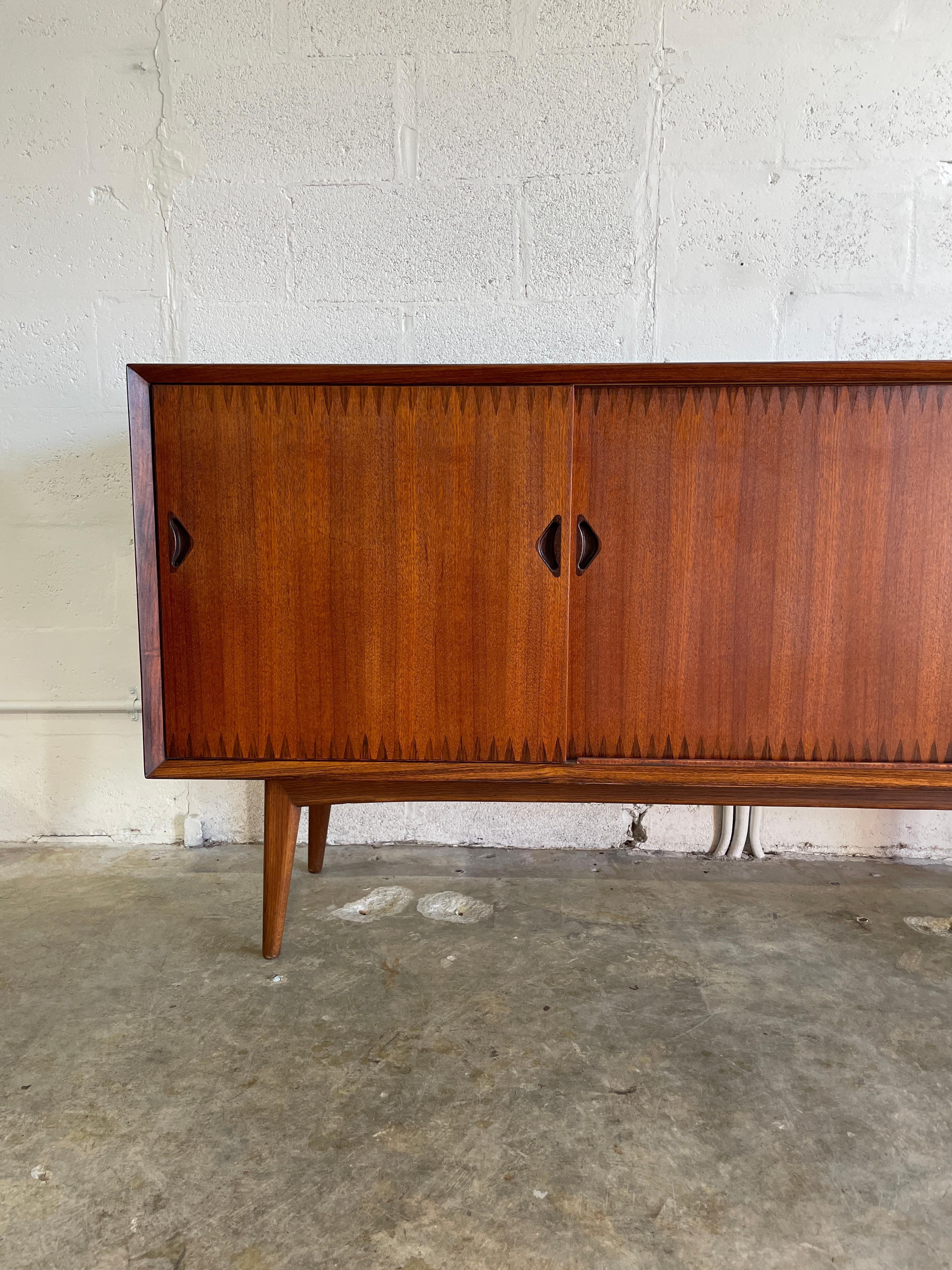 Mid Century Swedish Modern teak Console or Credenza with rosewood details by AB Westberg Mobler. 67w 17.75d 33h