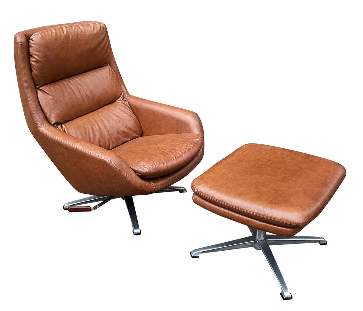 A sleek vintage chair and ottoman by Overman from Sweden circa 1970's. It features a swiveling base with tilt and a tilt locking feature. All 100% original and in very good ready for use condition. Measurement below is for chair only. Foot stool