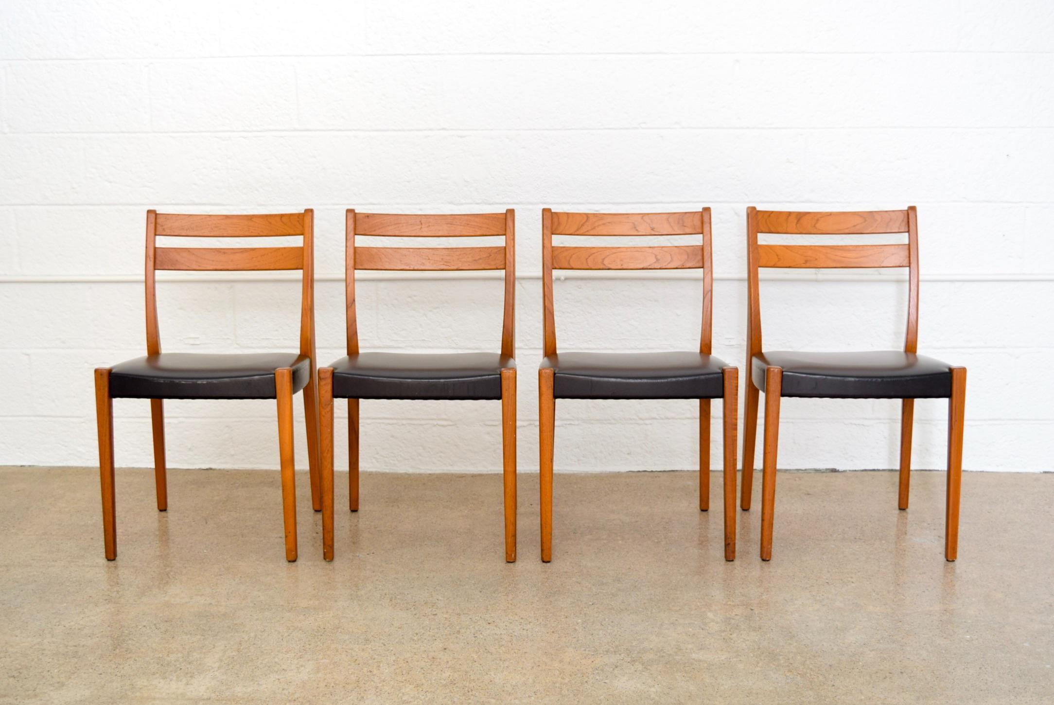 • Set of four vintage Mid-Century Modern Svegards Markaryd dining chairs made in Sweden, circa 1960.
• Beautiful Scandinavian Modern design features clean, Minimalist lines.
• Solid teak wood in a warm medium tone with black vinyl upholstered