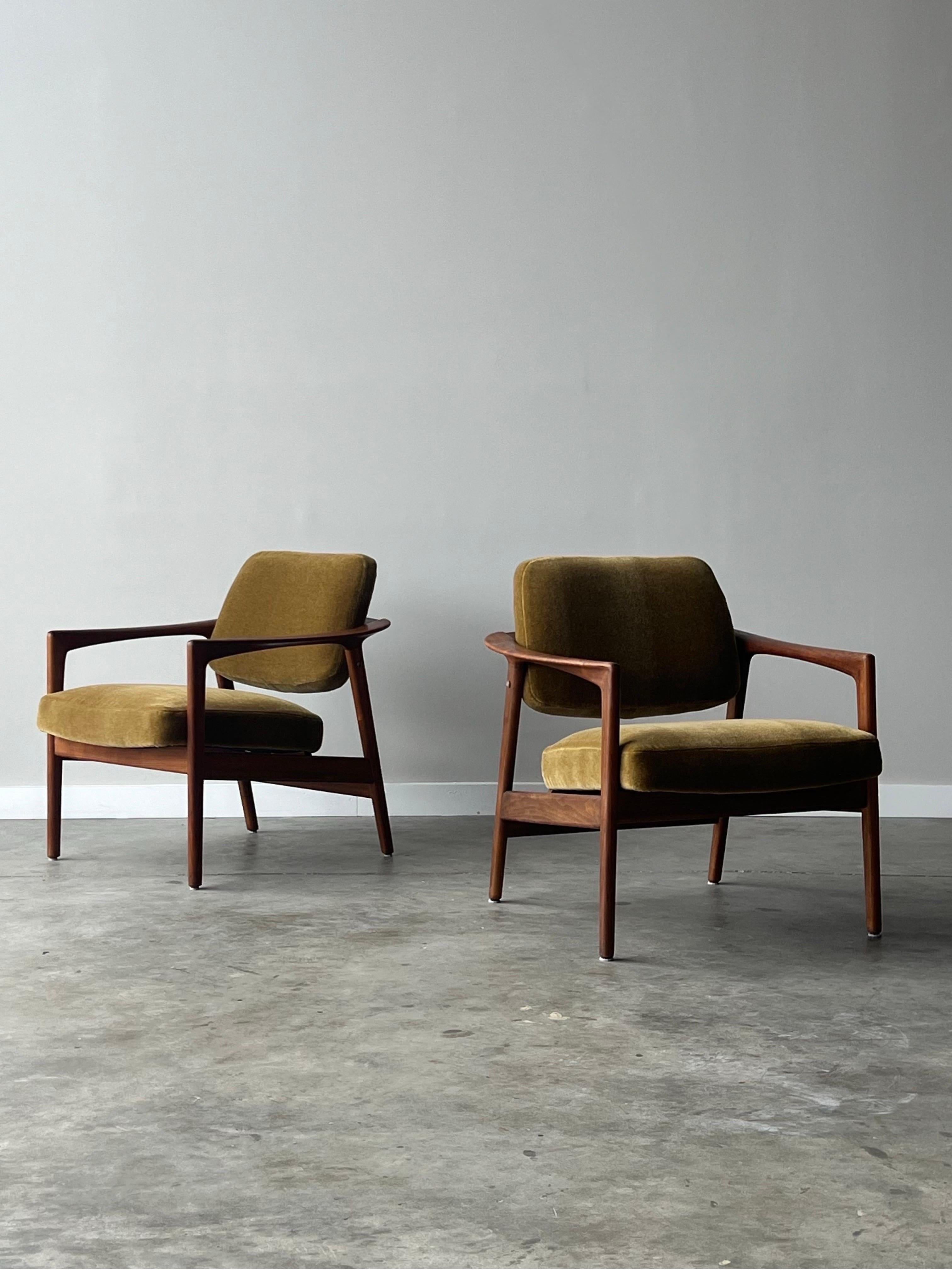 Mid Century Swedish Lounge Chairs by Folke Ohlsson for Dux. Upholstered in a warm golden yellow mohair fabric. These lounges are beautiful from all angles showcasing the exquisite Swedish design by framing the lounge in sculpted teak. A seldom seen