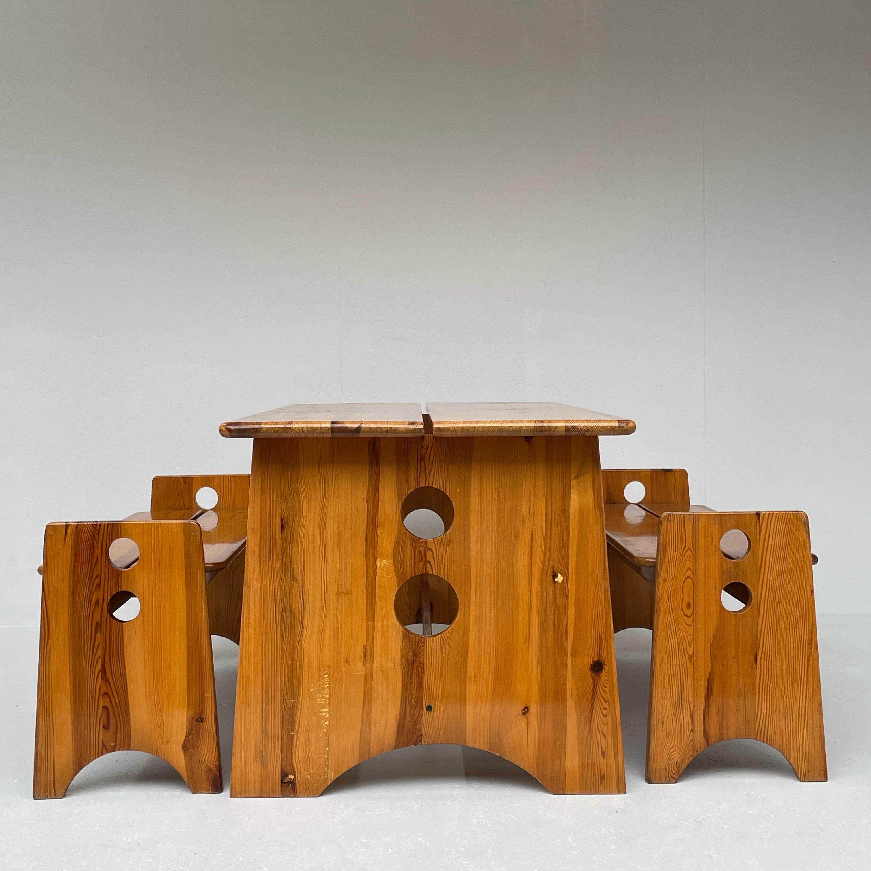 A Swedish solid wood dining set. A draft of Gilbert Marklund for Furunickarn.

AB. Period: 1969. 

This Vintage dining room set includes a handmade ash table with two matching sofas. The two benches can be pushed under the table. Ideal for