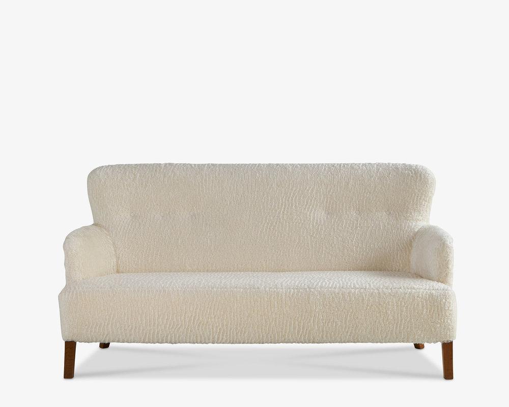 A beautiful midcentury Swedish loveseat that we have carefully restored and reupholstered in a Holly Hunt Great Plains Mohair. Great curves, button tufts, and wood legs.

Dimensions: 69” W x 36” H x 30” D

Condition: Excellent.
