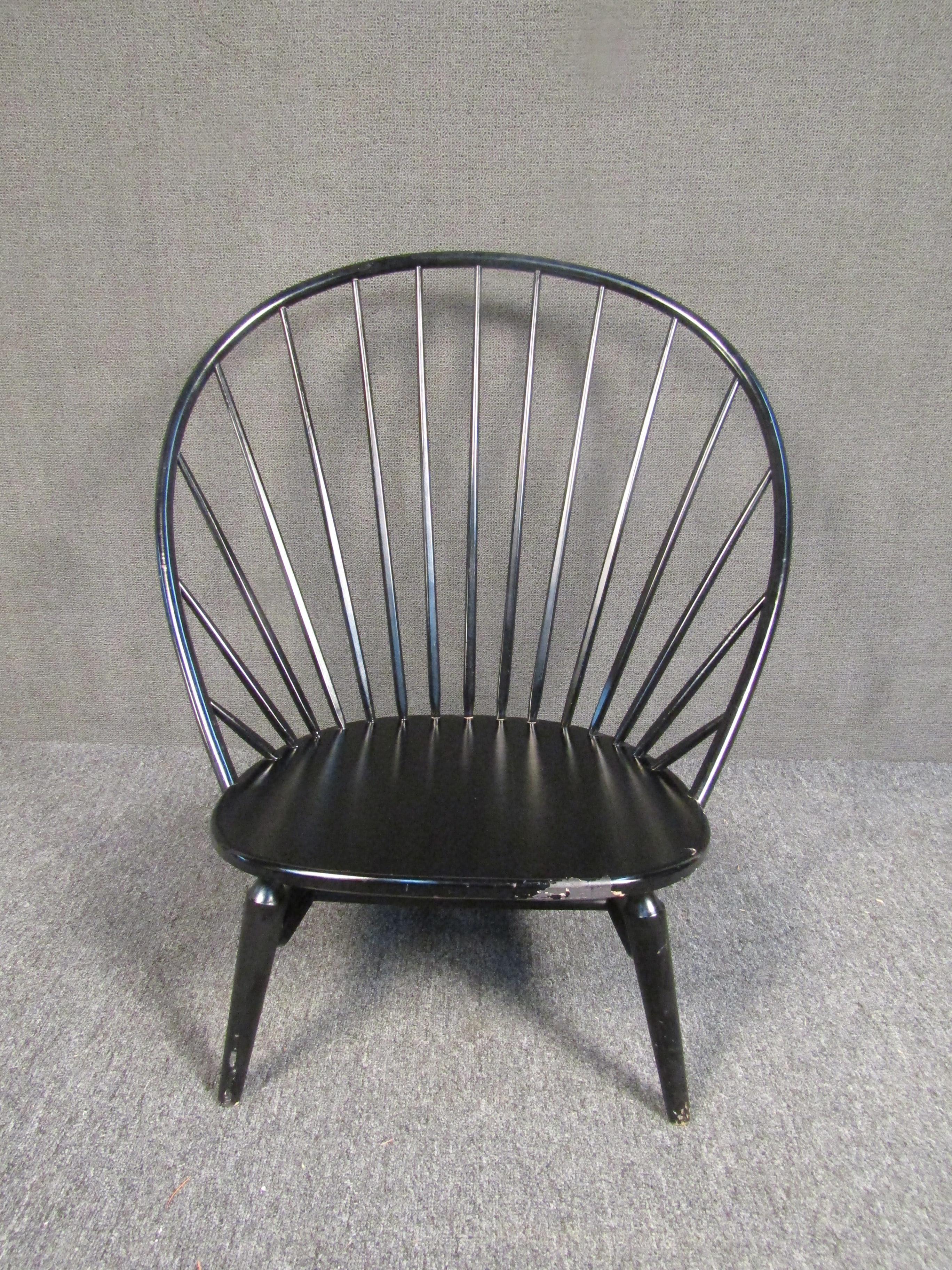 Swedish modern wood peacock spindle lounge chair. Item features solid wood construction, clean modern lines, style and form. In the style of Hans Wegner. 

(Please confirm item location - NY or NJ - with dealer).
   
