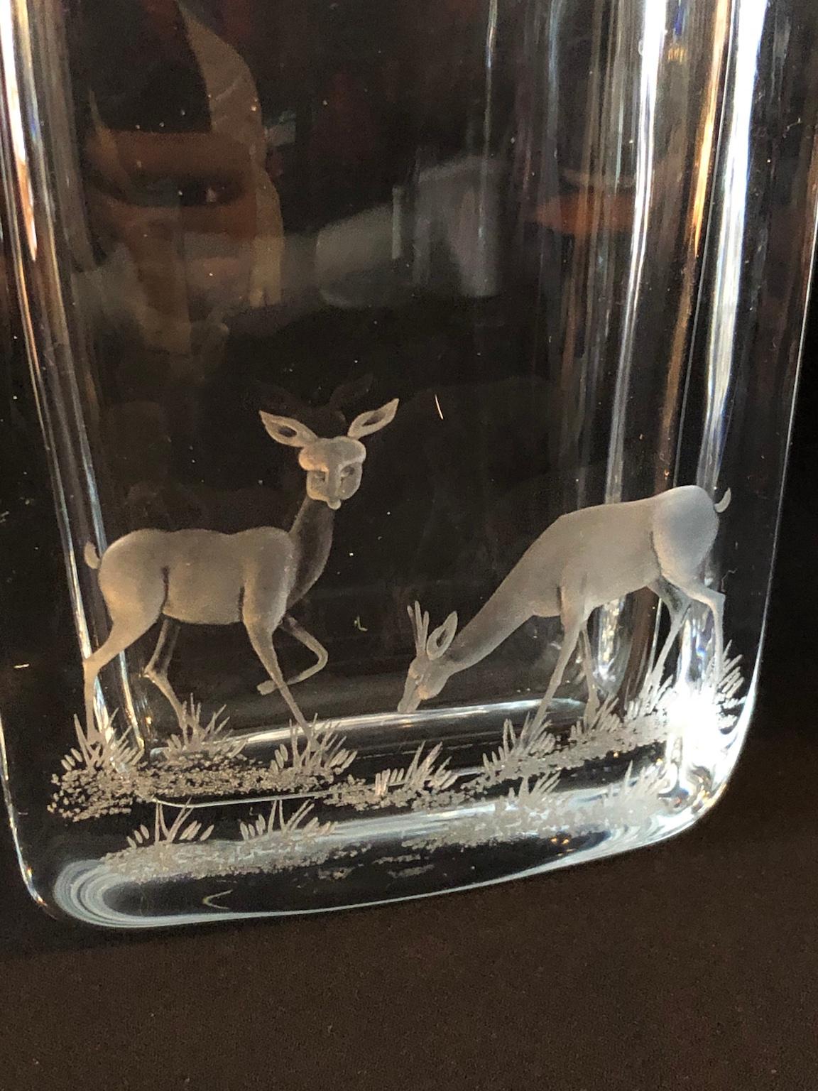 Midcentury Swedish Strombergshyttan art glass vase, etched with pair of Deers, circa 1950

Exquisite Mid-Century Modern Swedish Strombergshyttan art glass vase.
The lozenge shaped vase, with thick glass walls is acid etched on one side
Depicting a
