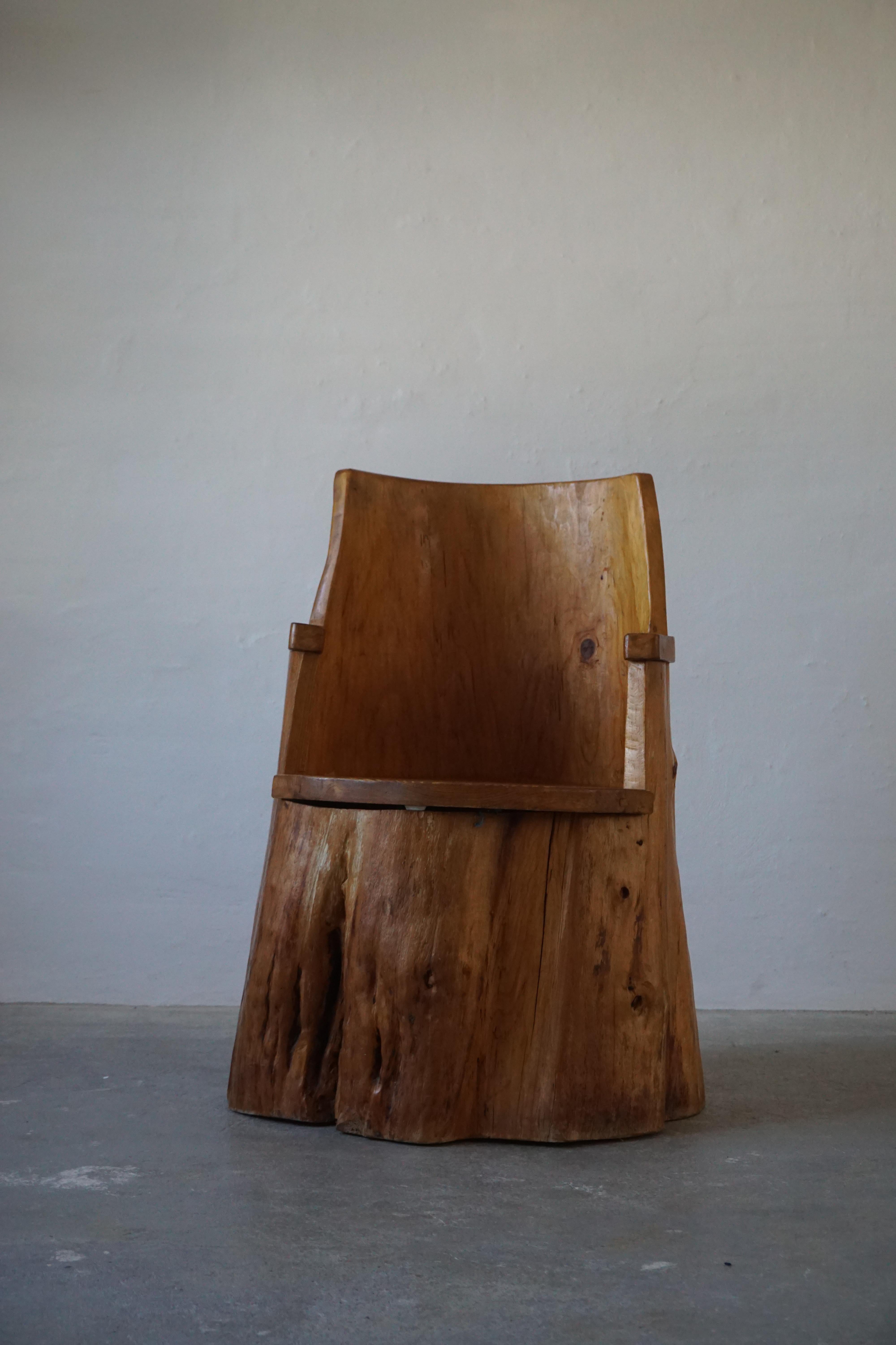 Mid-century Swedish stump chair in pine. Primitive style. Dated 1975
In good vintage and original condition showing beautiful patina.

Honorable mentions in similar style include Roland Wilhelmsson, Pierre Chapo, and Axel Einar Hjorth.
  