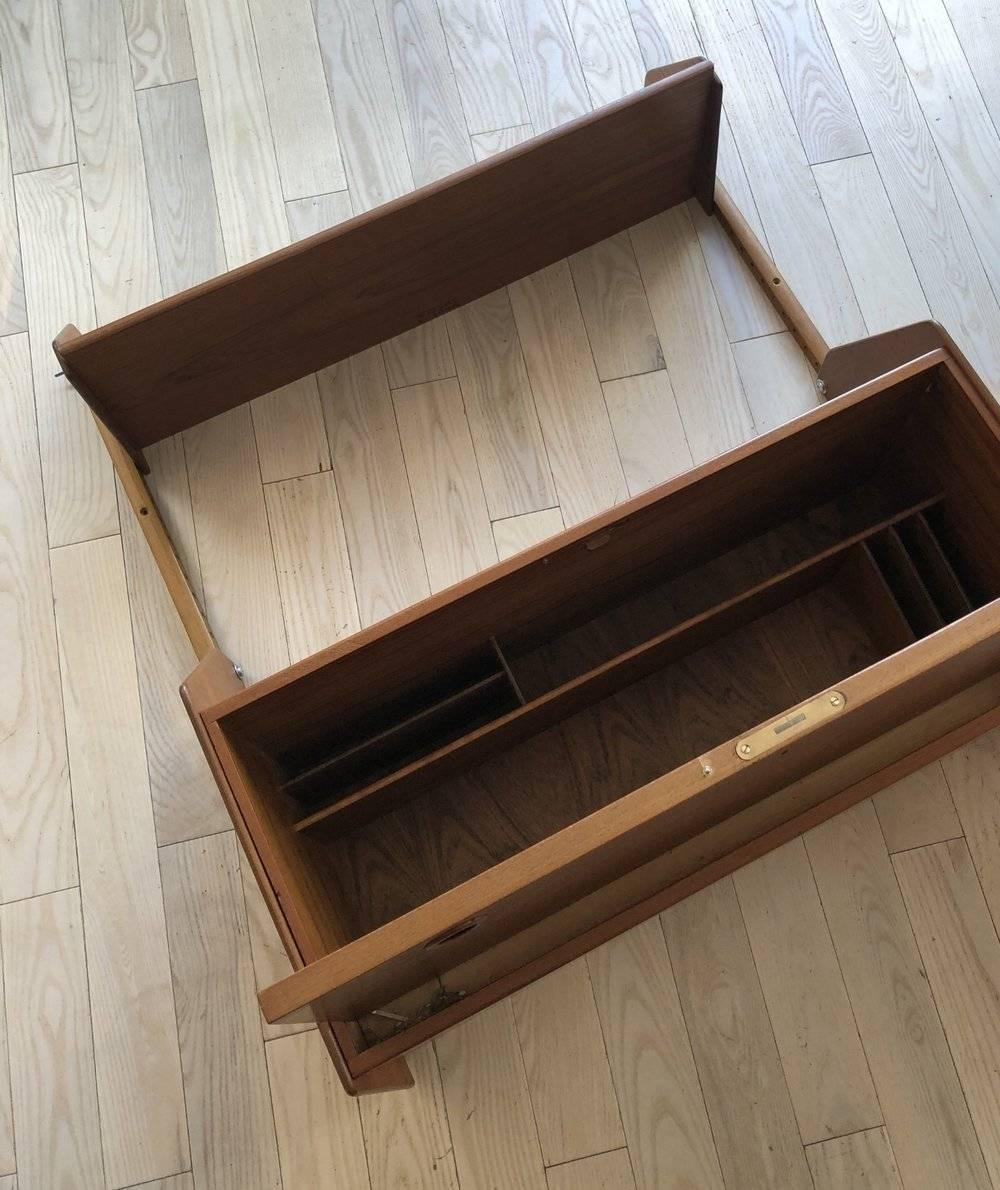 Beautiful teak midcentury Swedish floating secretary desk. Adjustable shelve above. Easy to install, the desk and shelve hangs from the rail that is connected to the wall. Drop down easy to open and close desk top. Does not come with a key. Super