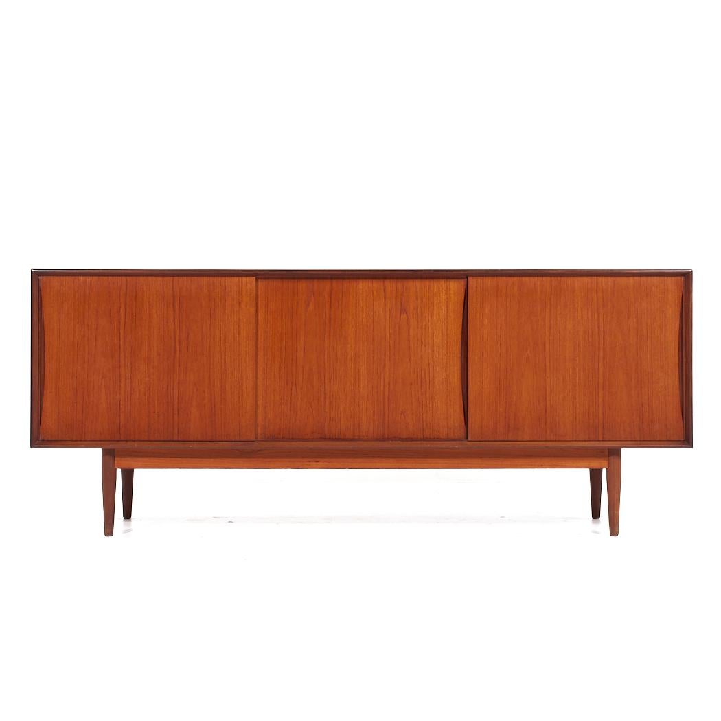 Mid Century Swedish Teak Sliding Door Credenza

This credenza measures: 75.5 wide x 19 deep x 30.75 inches high

All pieces of furniture can be had in what we call restored vintage condition. That means the piece is restored upon purchase so it’s