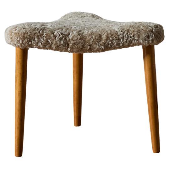 Mid-Century Swedish Triangular Stool in Birch and Curly Sheepskin For Sale