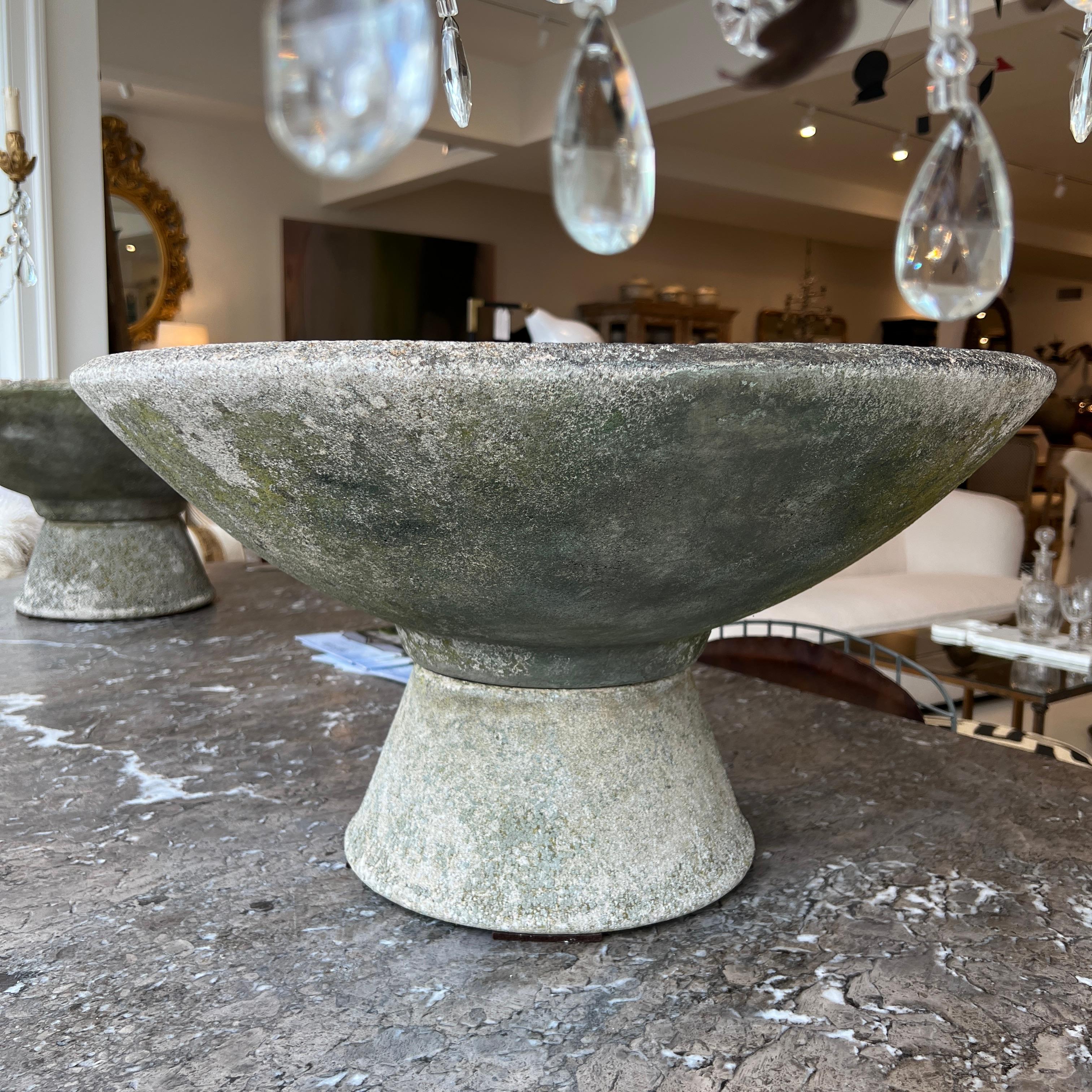 This sculptural pair of mid-century Swiss Willy Guhl jardinieres showcases the iconic aesthetic with their weathered patina and sleek hourglass form. They would make a great addition to both indoor and outdoor spaces. 