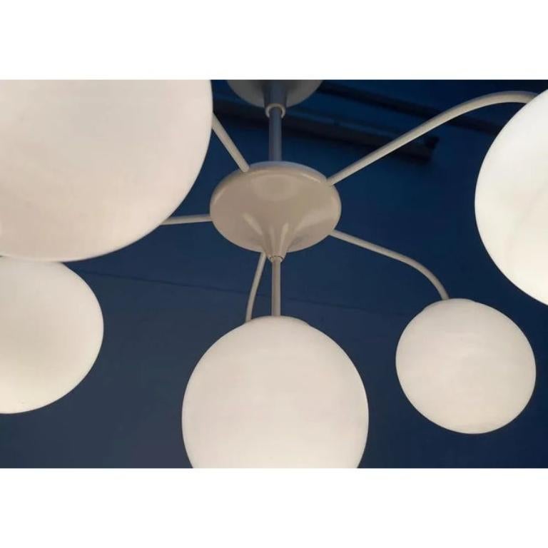 Elegant ceiling candlestick from temde according to a design by e. R. Nele.

classic and yet timelessly modern. Opal glass balls are sitting at the end of curved bridges that go off a central point. The bridges look very filigree, undiminished for