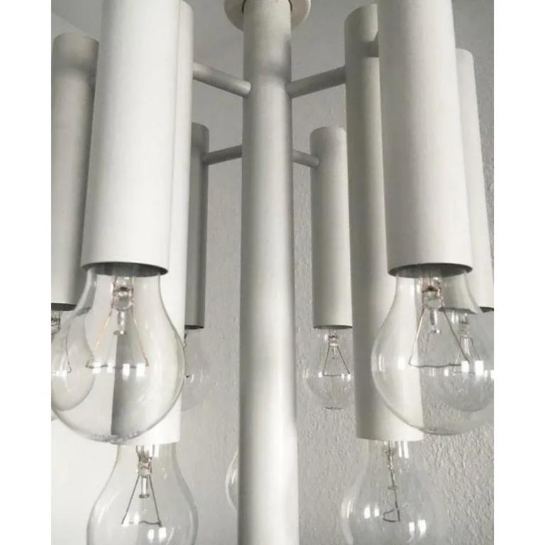 Imposing ceiling lights from temde. Functional light source and at the same time luminous object in the room. A very contemporary chandelier.

The lamp consists of a central, long cylinder, around the 9 other cylinders or branches off. The length of