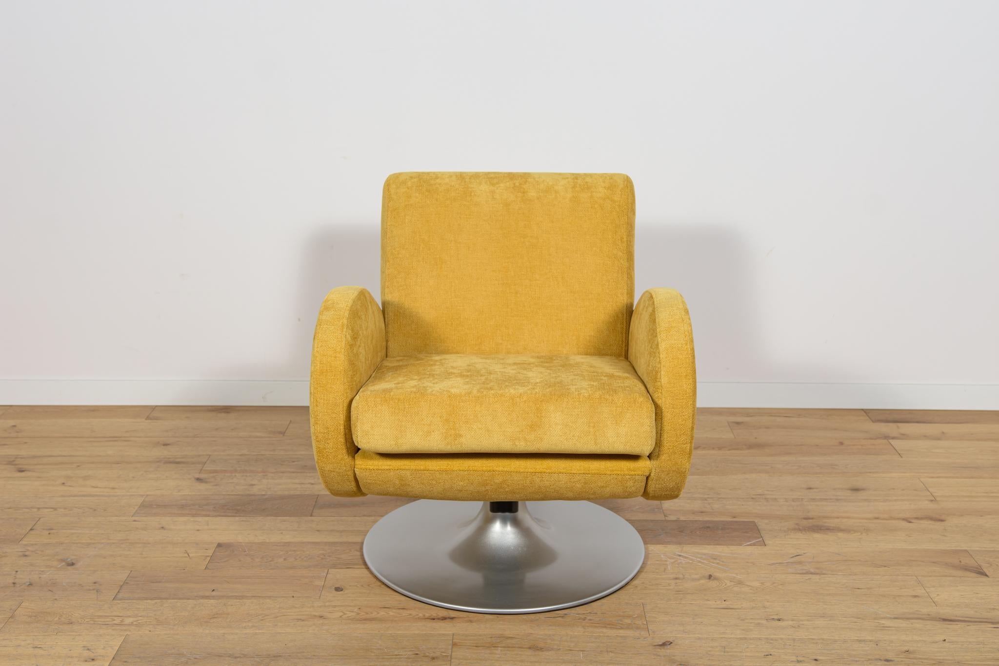 The Mid Century style armchair made in Denmark in the 1960s. The armchair have a unique shape, have a swivel function and a gentle rocking function. The armchair have undergone a comprehensive renovation. The base elements have been repainted. The