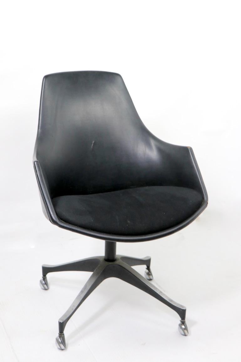 Stylish and well-made swivel office, desk chair by I.V. chair company Brooklyn NY (109 Jewel St). Interesting example of Brooklyn modern after Fritz Hansen etc. This chair shows cosmetic wear, including a tear in the vinyl backrest, and general
