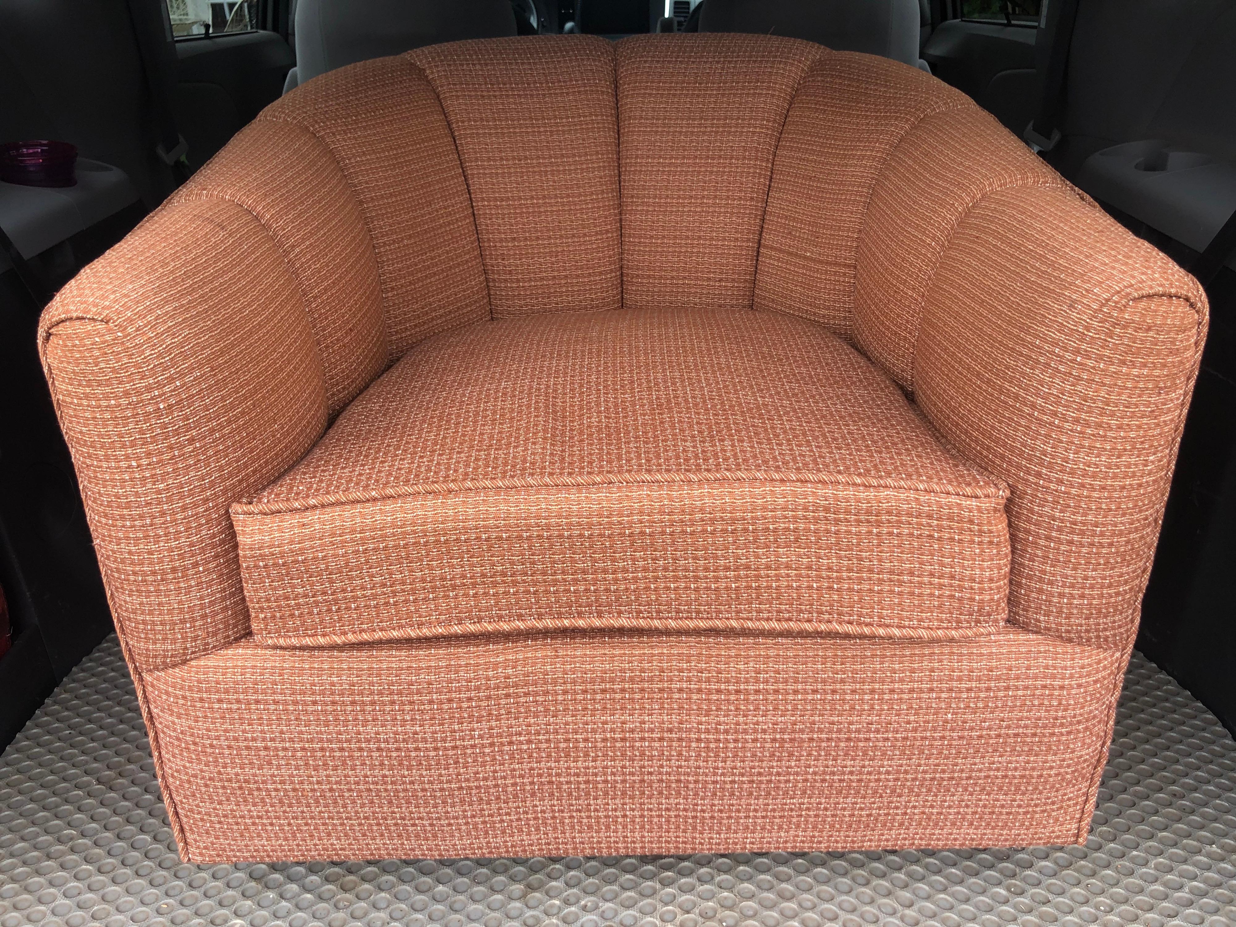 Mid Century Swivel club chair. Coral rust tone with a nice textural weave. Classic cube shape and so 