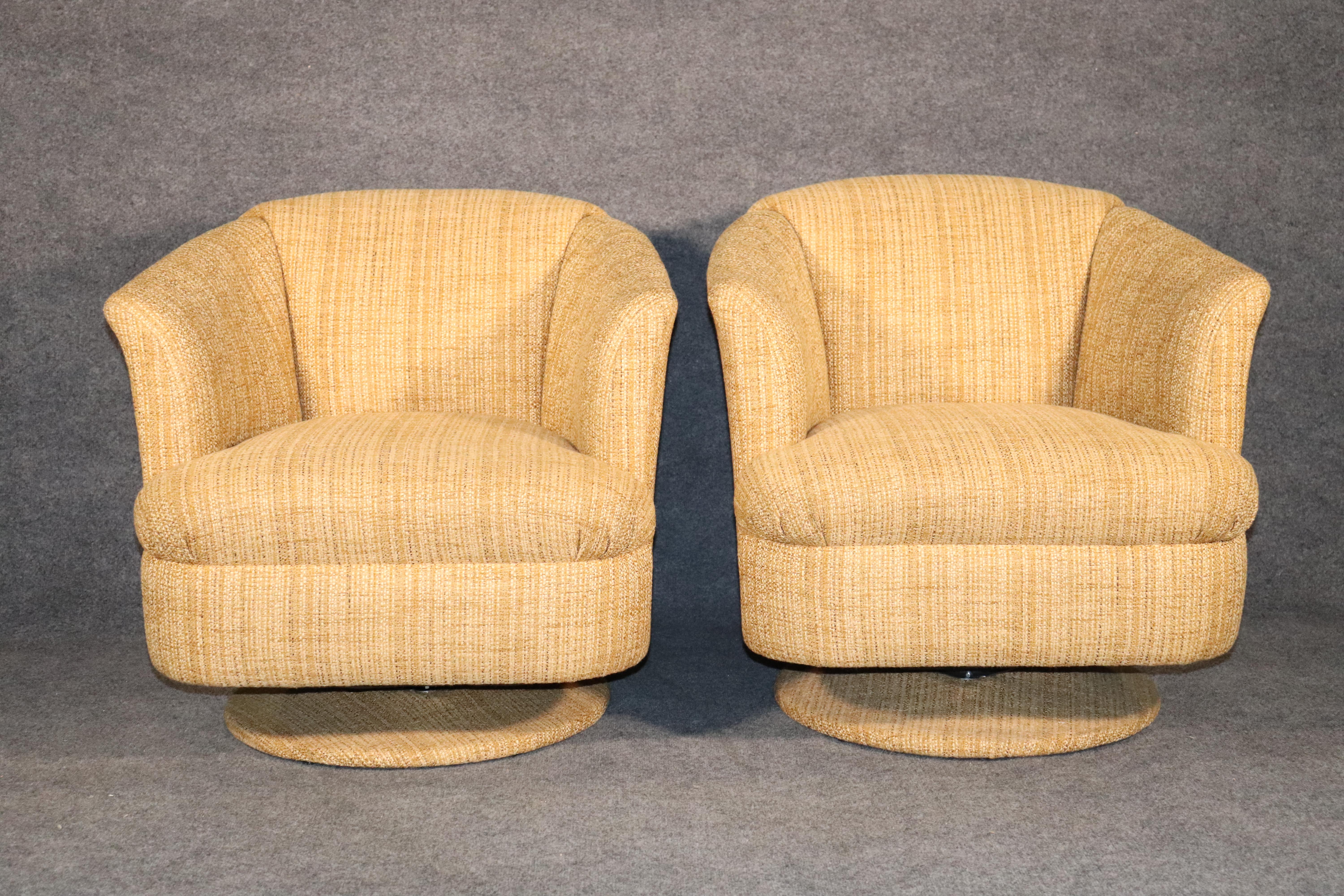 Pair of vintage modern club chairs on a tulip shape swivel base. Round barrel back with sculpting arm lines.
Please confirm location.