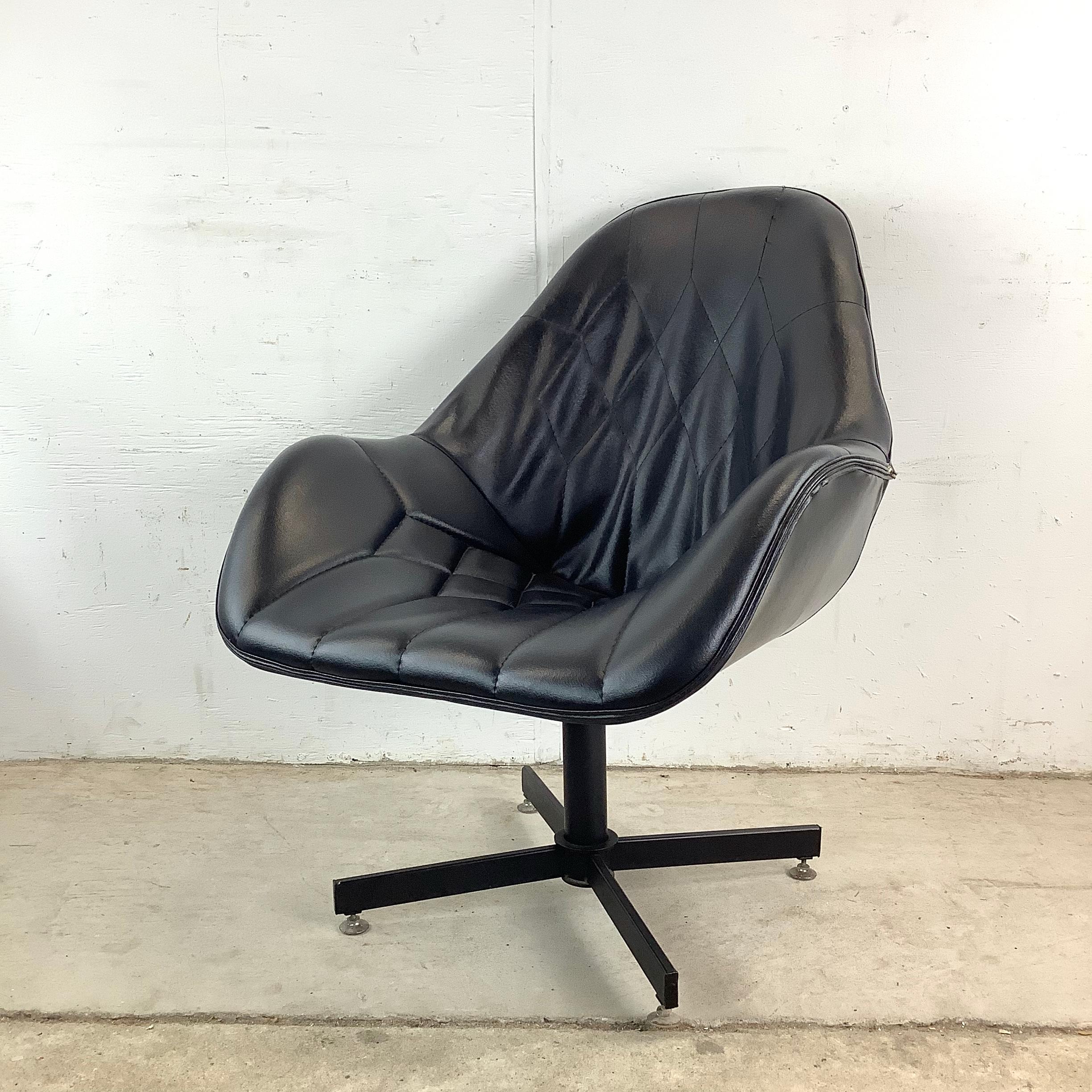 Bold yet graceful, this Mid-Century swivel lounge chair encapsulates the sculptural innovation of the era with a shape that feels like functional art. Its smooth lines and striking presence evoke the space-age optimism of mid-20th century design,