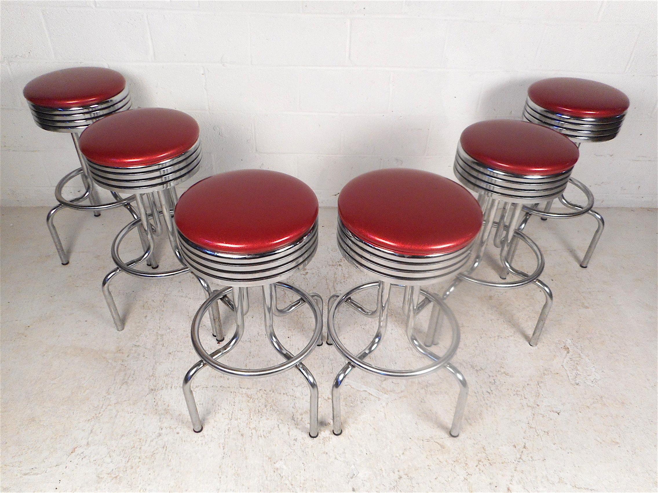 Stylish set of 6 midcentury stools. Sturdy chrome frame with footrests and swiveling seats. Classic longneck design. Sure to make an interesting addition to any modern interior. Please confirm item location with dealer (NJ or NY).