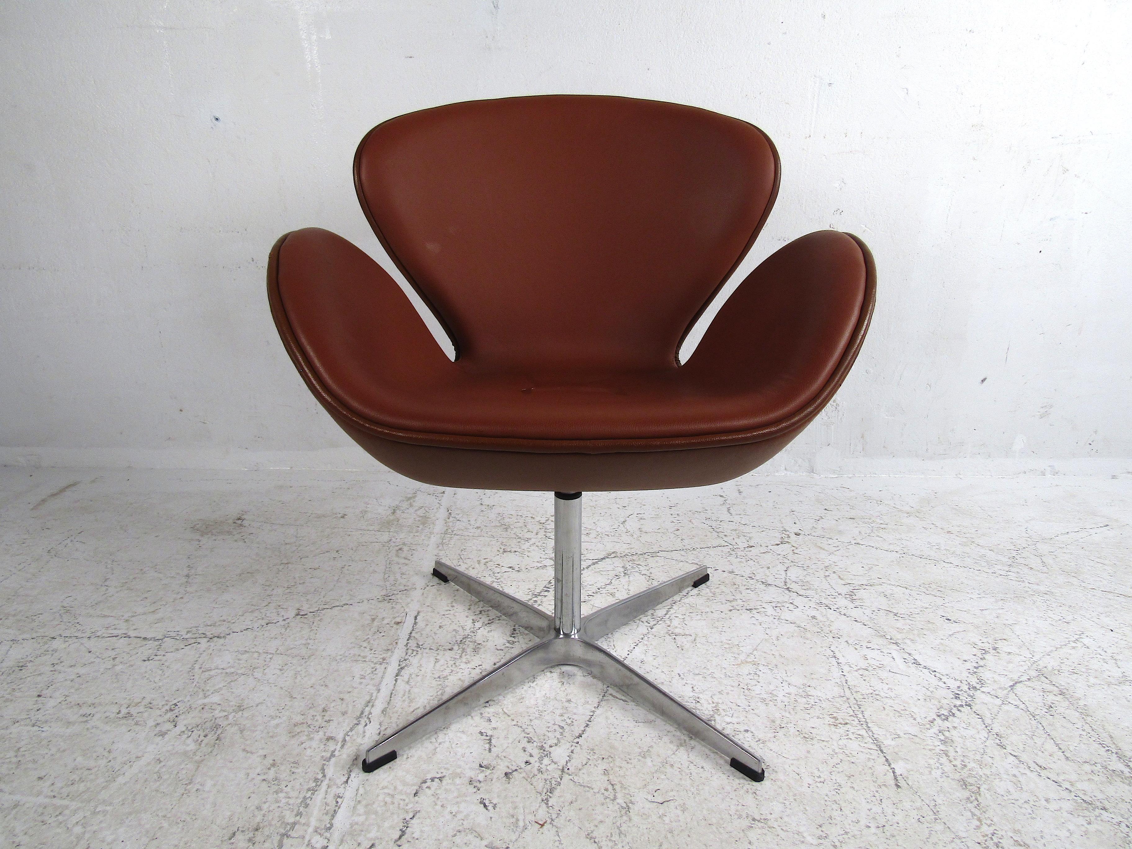 Stylish midcentury swiveling chair styled after Arne Jacobsen's 