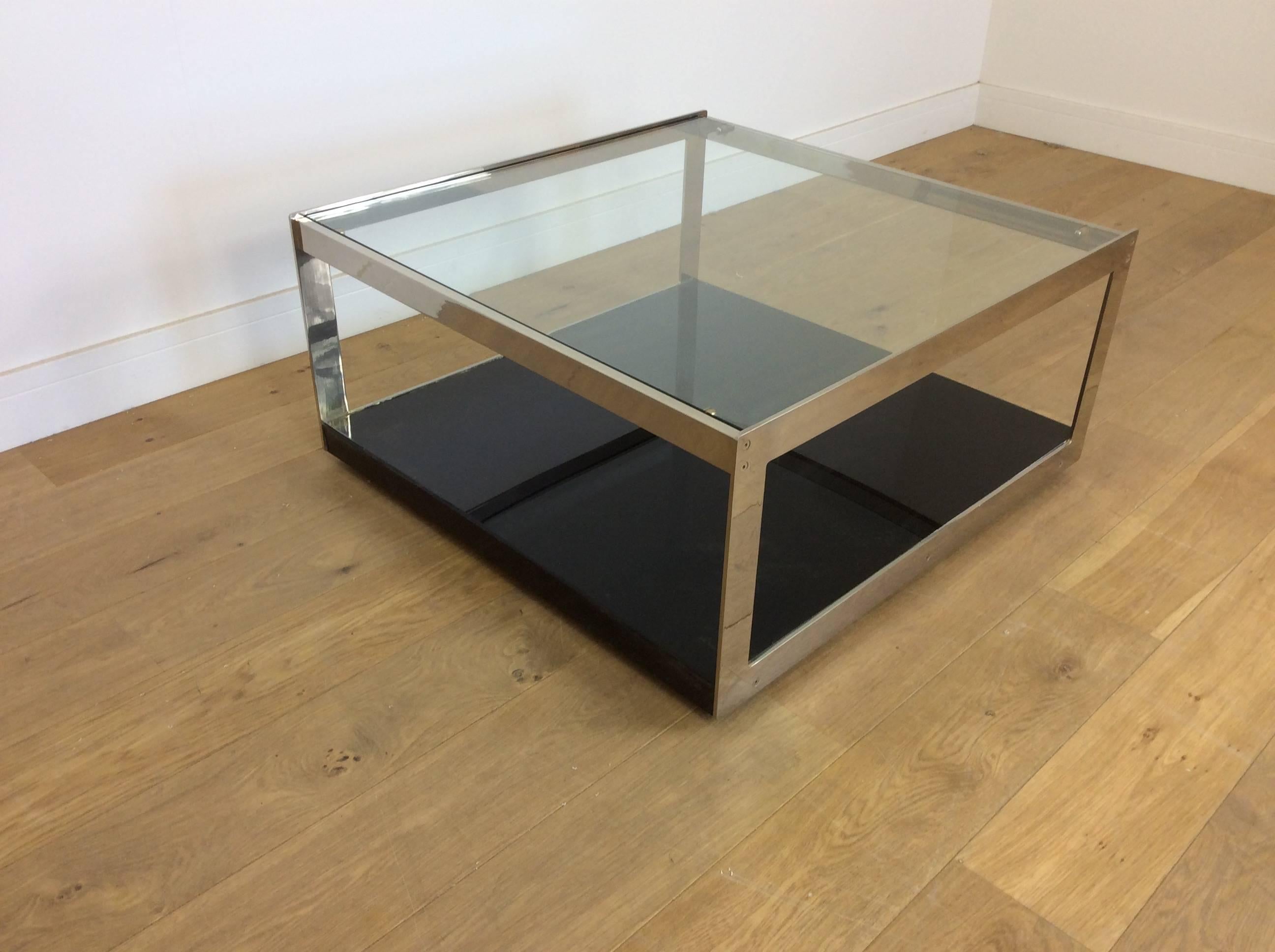 Merrow Associates.
Midcentury large cocktail table by Merrow Associates, high quality flat chrome base with plate glass top and rare black laminate base.
Designed by Richard Young.
Measures: 40 cm H 86 cm W 83 cm D.
British, circa 1970.