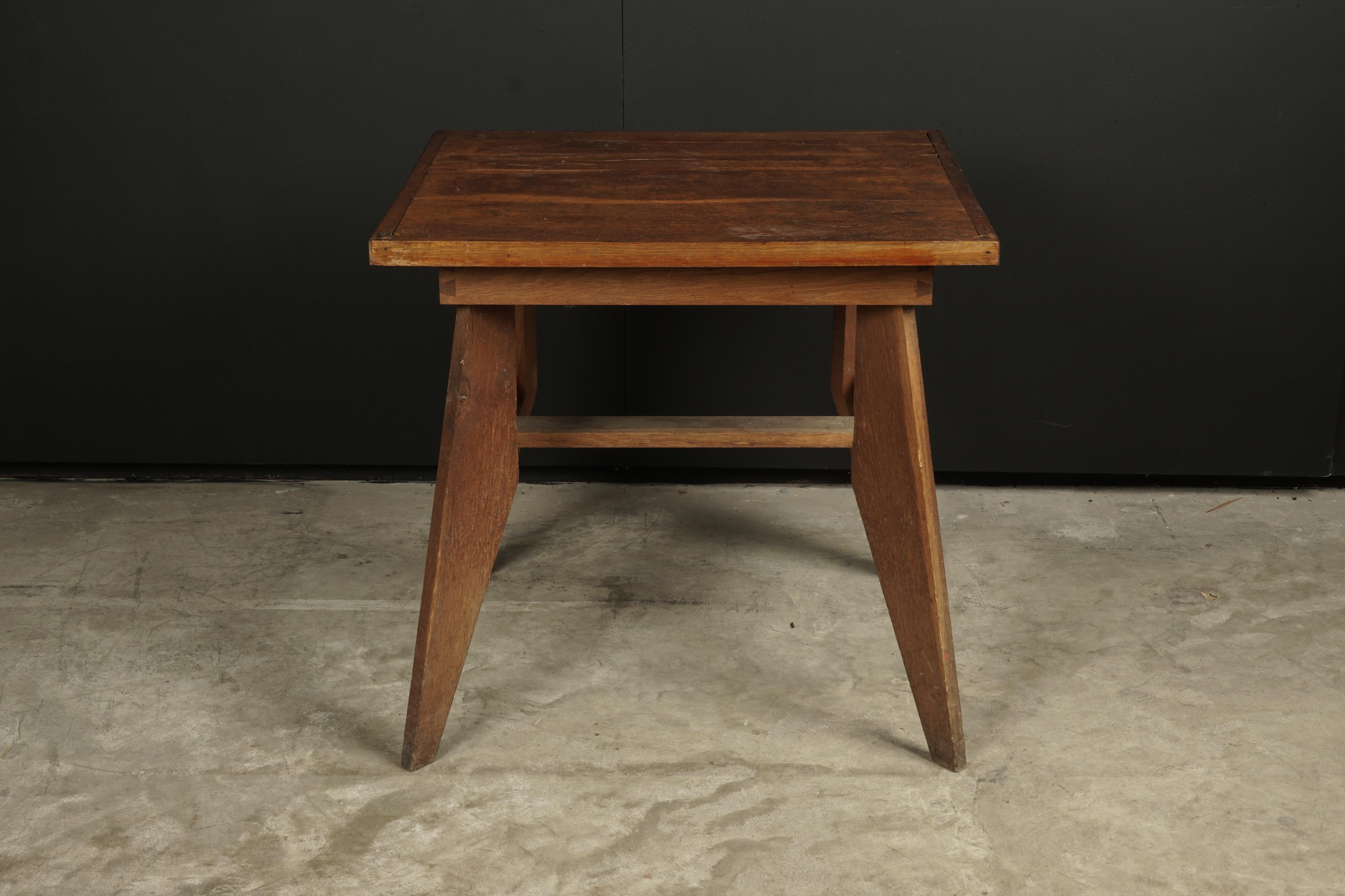 Midcentury console table designed by Rene Gabriel, France, circa 1945. Oak construction with nice wear and patina.