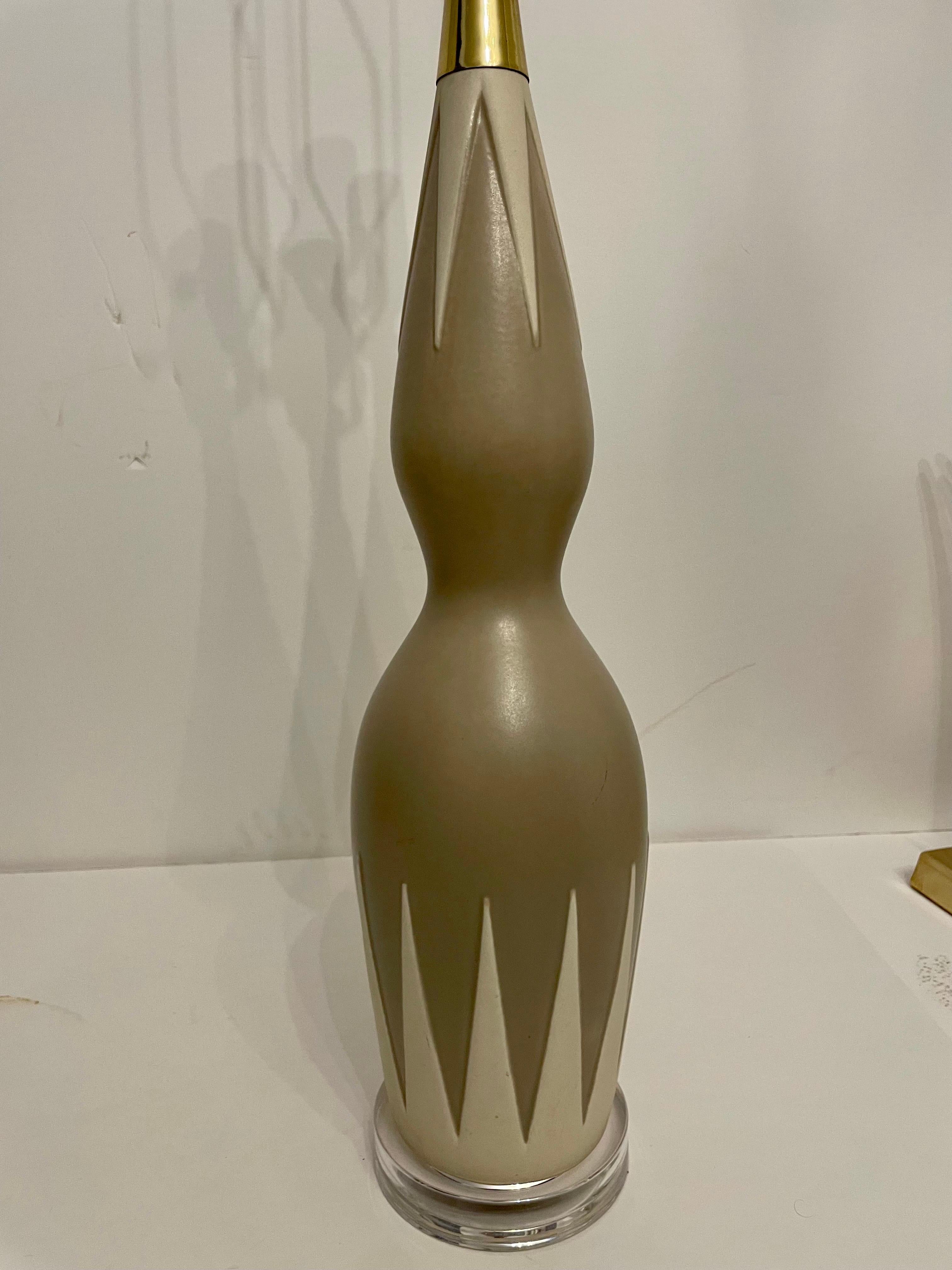 Mid century Hourglass lamp by Gerald Thurston for Lightolier with Lucite base, ceramic body and brass fittings. New 3 way brass socket and wiring. Original solid brass finial. Shade not included. Good overall condition, few light rubs to finish. 6