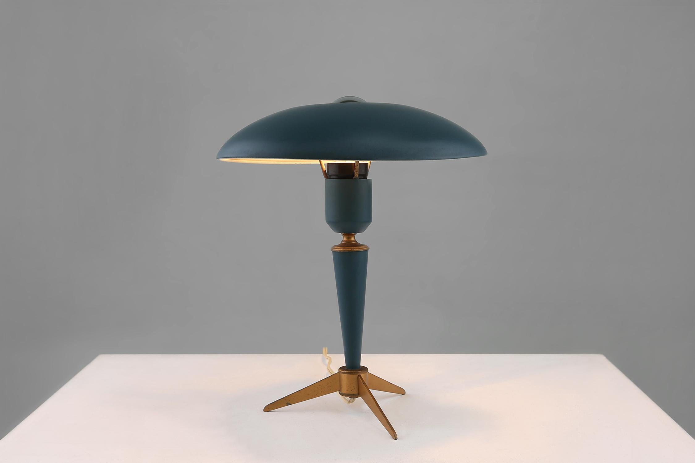 Lamp designed by Louis Kalff for Philips. is made of dark green and metal. Has a timeless design and is very elegant