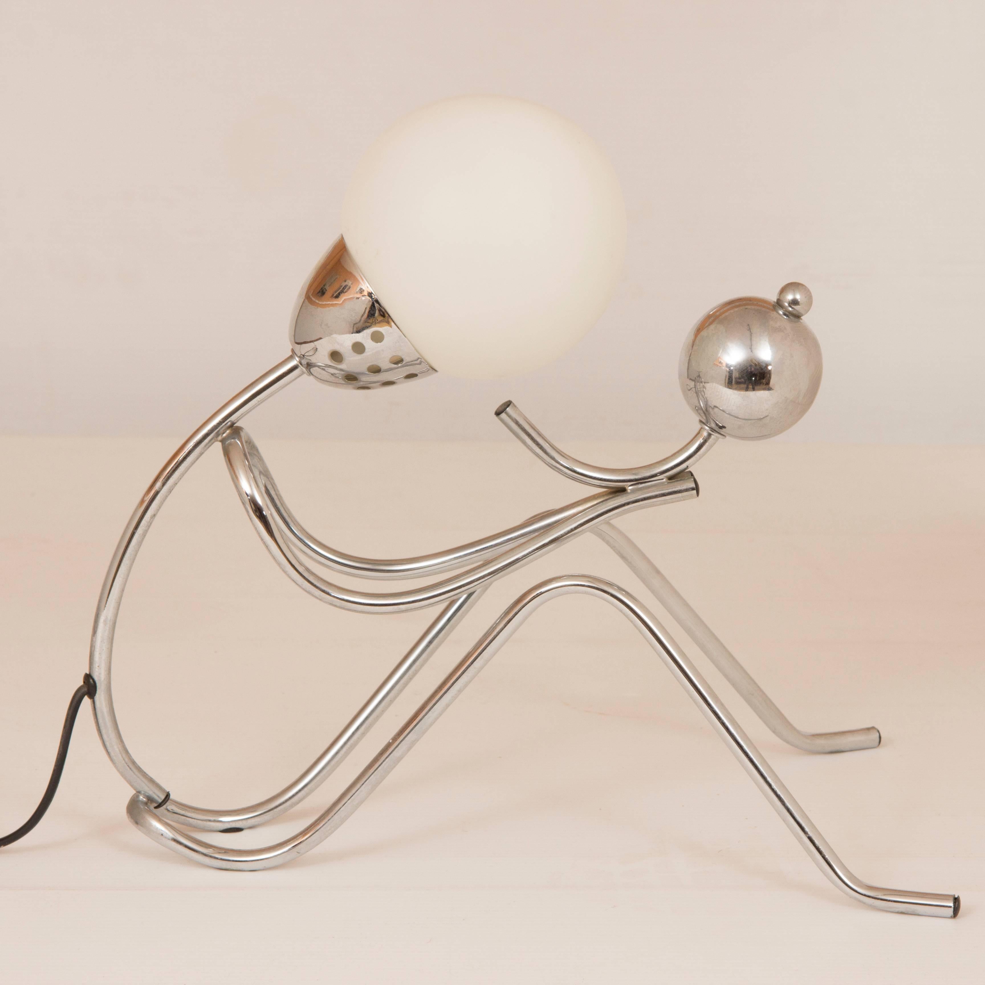Awesome midcentury table lamp.
Midcentury table lamp figure with child.
Midcentury tubular chrome figure lamp holding baby.
British, circa 1970
Measures: H 35 cm, W 40 cm, D 24 cm.