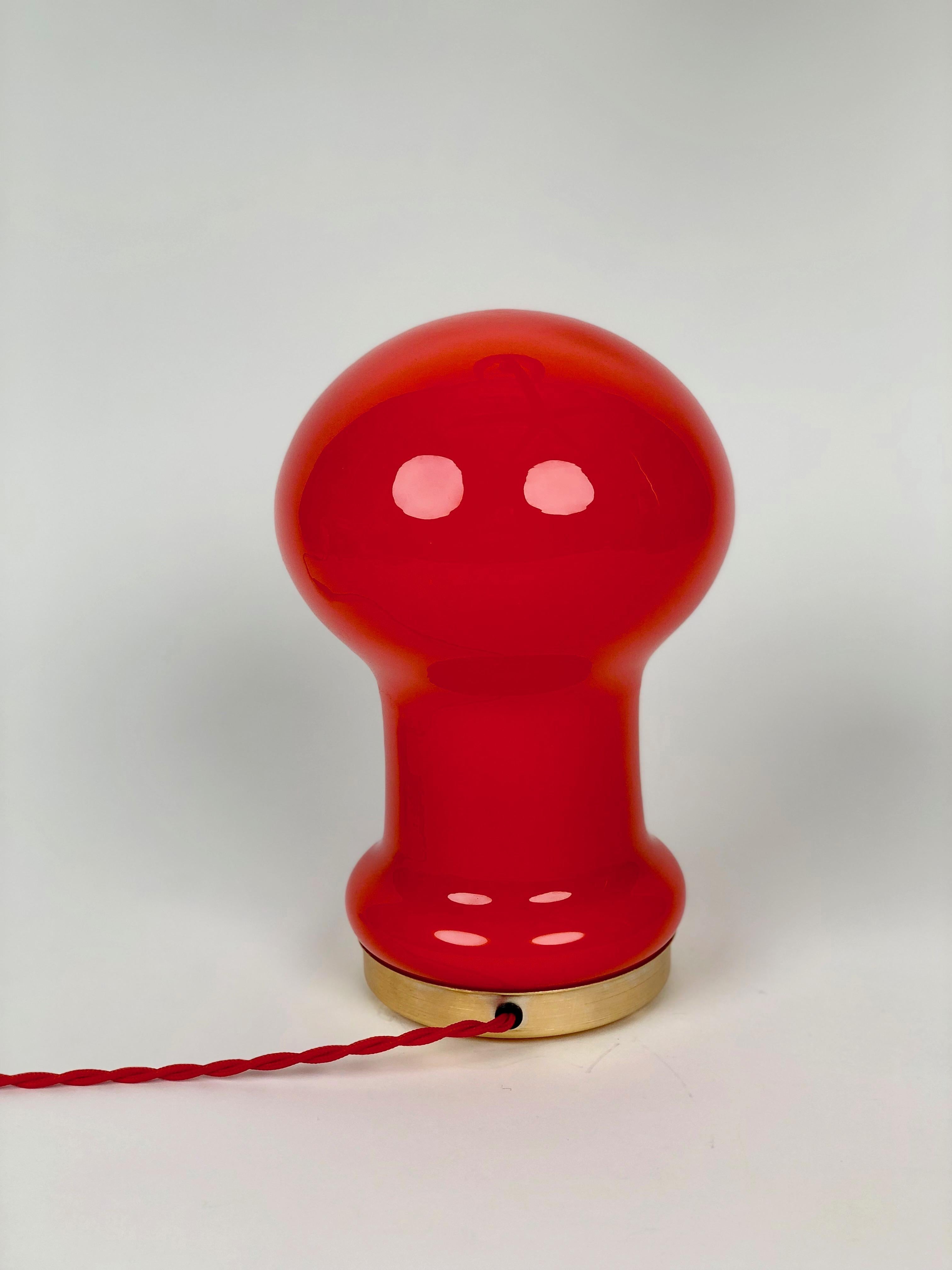 A beautiful red orange, opaline glass table lamp produced by OPP Jihiava and
designed by Stepan Tabery in the 1970's in Czechoslovakia.

The metal base is made from brass coloured aluminium , the new textile cable is from Italy and gives the lamp a