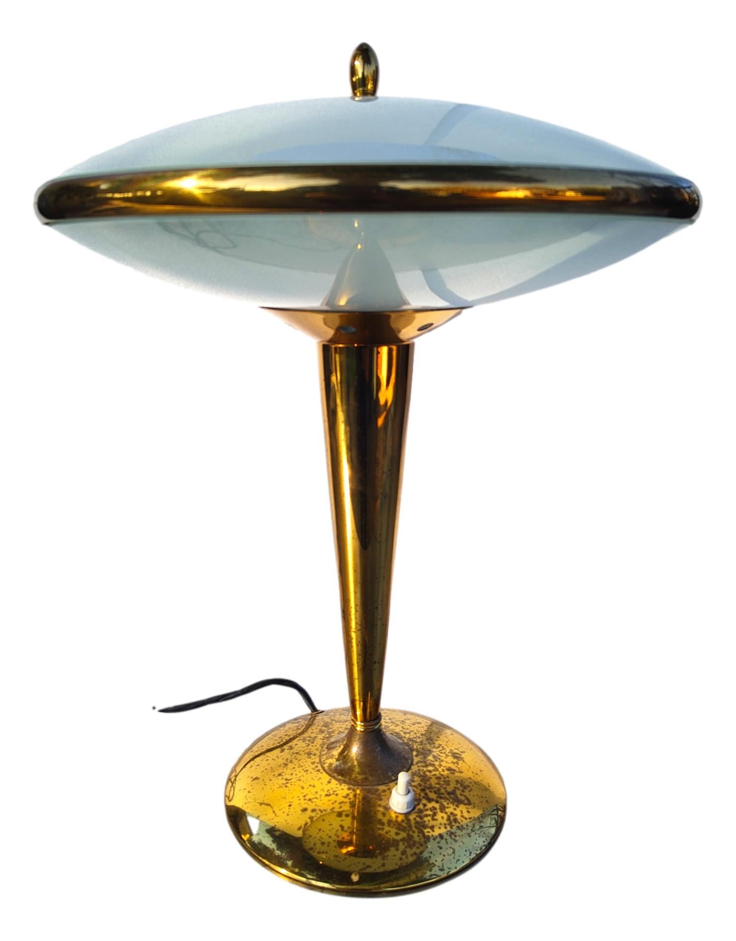 wonderful and rare midcentury table lamp, probably design by pietro chiesa for fontana arte or oscar torlasco.
Made all in brass with double opaline glass.
These are the measurements:
height cm 39, diameter of the top part cm 30, diameter of the