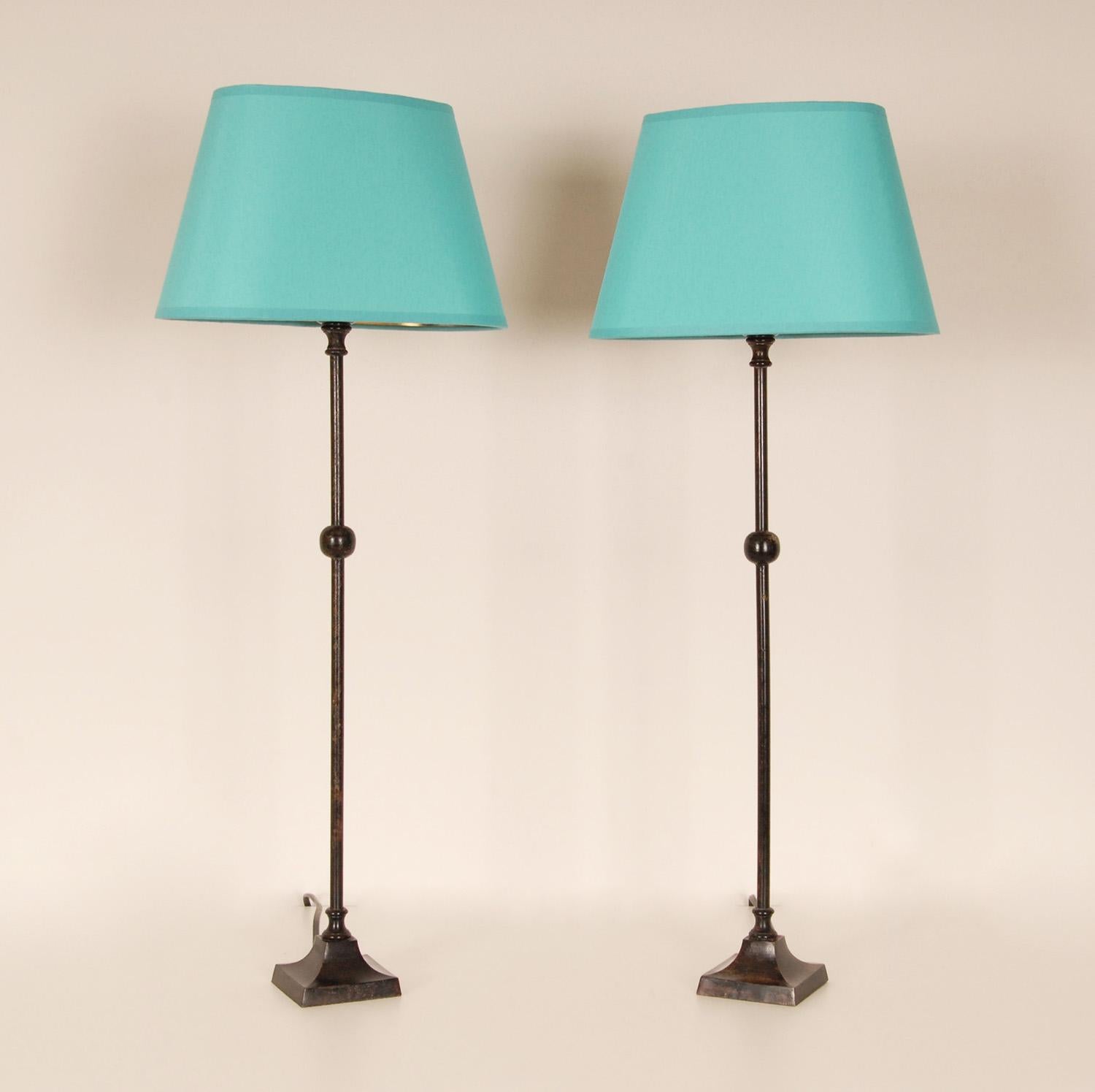 Vintage French Wrought iron table lamps Mid century 
Material: Cast Iron and Fabric
Style: Vintage, Art deco, Mid Century, Industrial
Design: In the style of Chapman, Jaques Adnet, Gilbert Poillerat.
Origin: France, 1970 - 1979
Color: Black,
