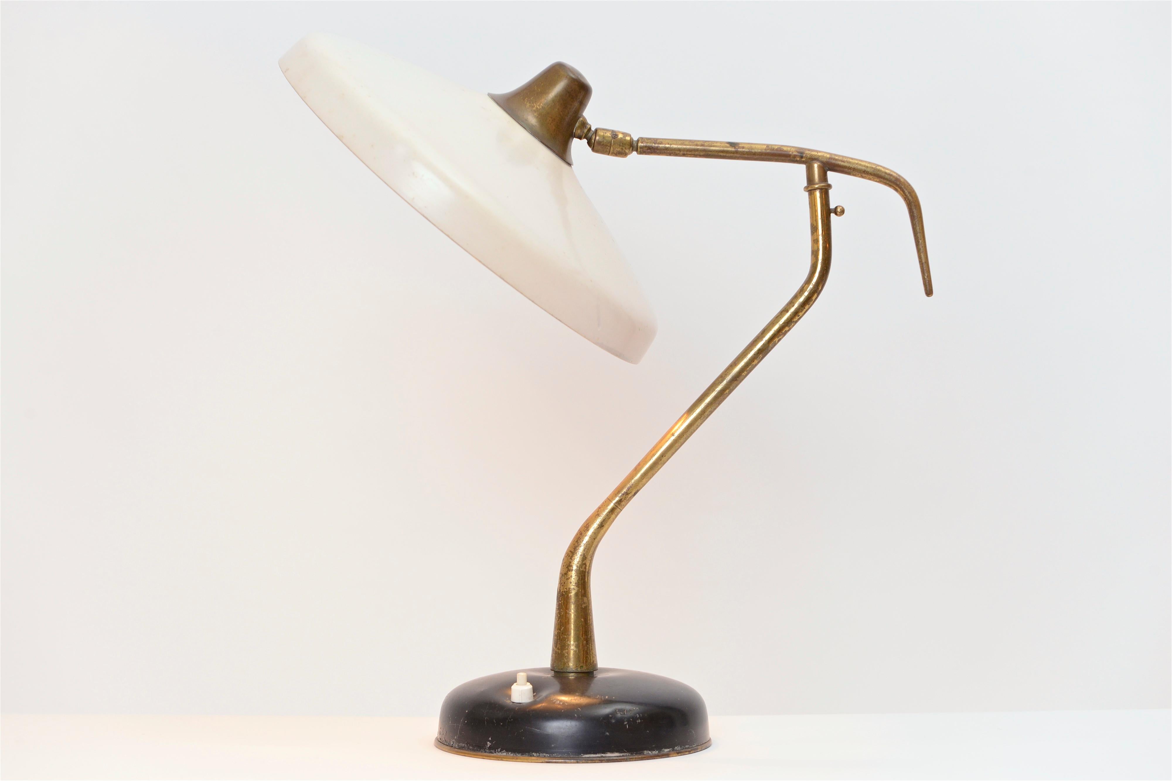 A rare 1950s brass and aluminium table or desk lamp by Oscar Torlasco. Produced by the prestigious Milanese company, Lumi, this light was manufactured using the best quality materials available at the time and remains one of Torlasco’s most classic