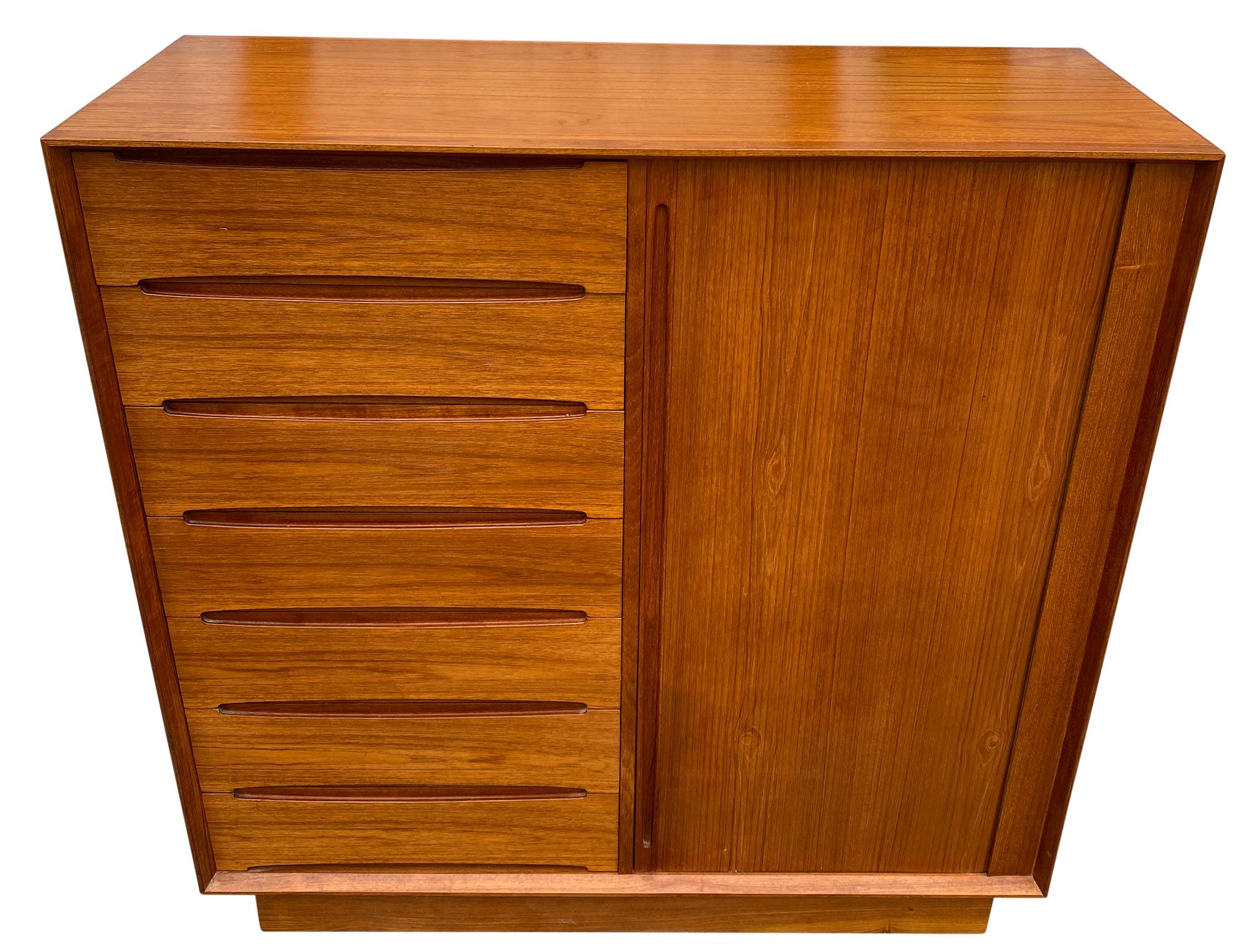 Midcentury tall Dyrlund teak dresser credenza 7-drawer on left. Clean inside and out - labeled - Made in Denmark. Good vintage condition. Has right sliding door with 8 drawers.