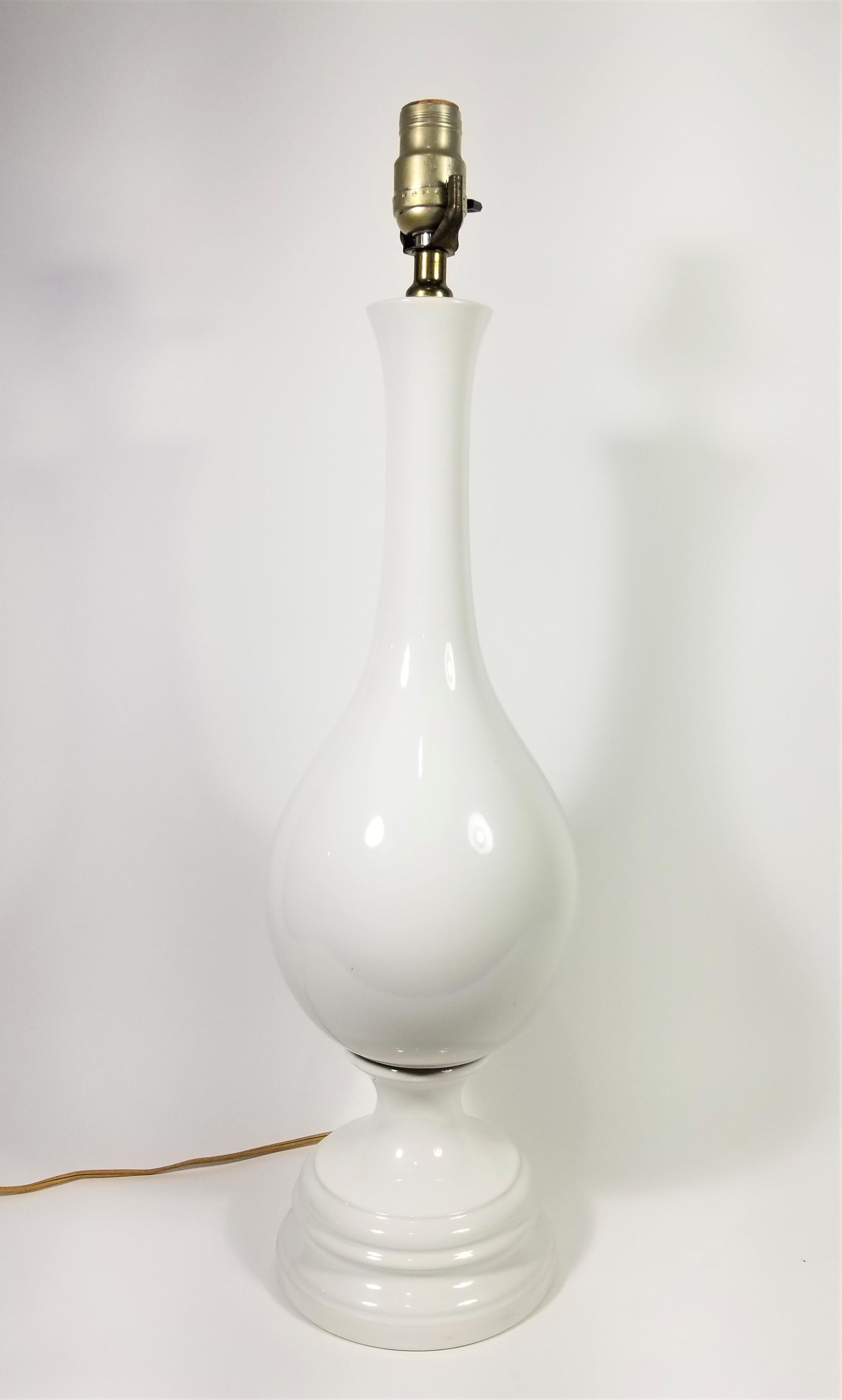 1970s Mid Century Tall Glazed Ceramic Table Lamp
Measurements:
Total Height: 25.50 inches
Top of Ceramic Height: 21.75 inches
Diameter: 7.0 inches