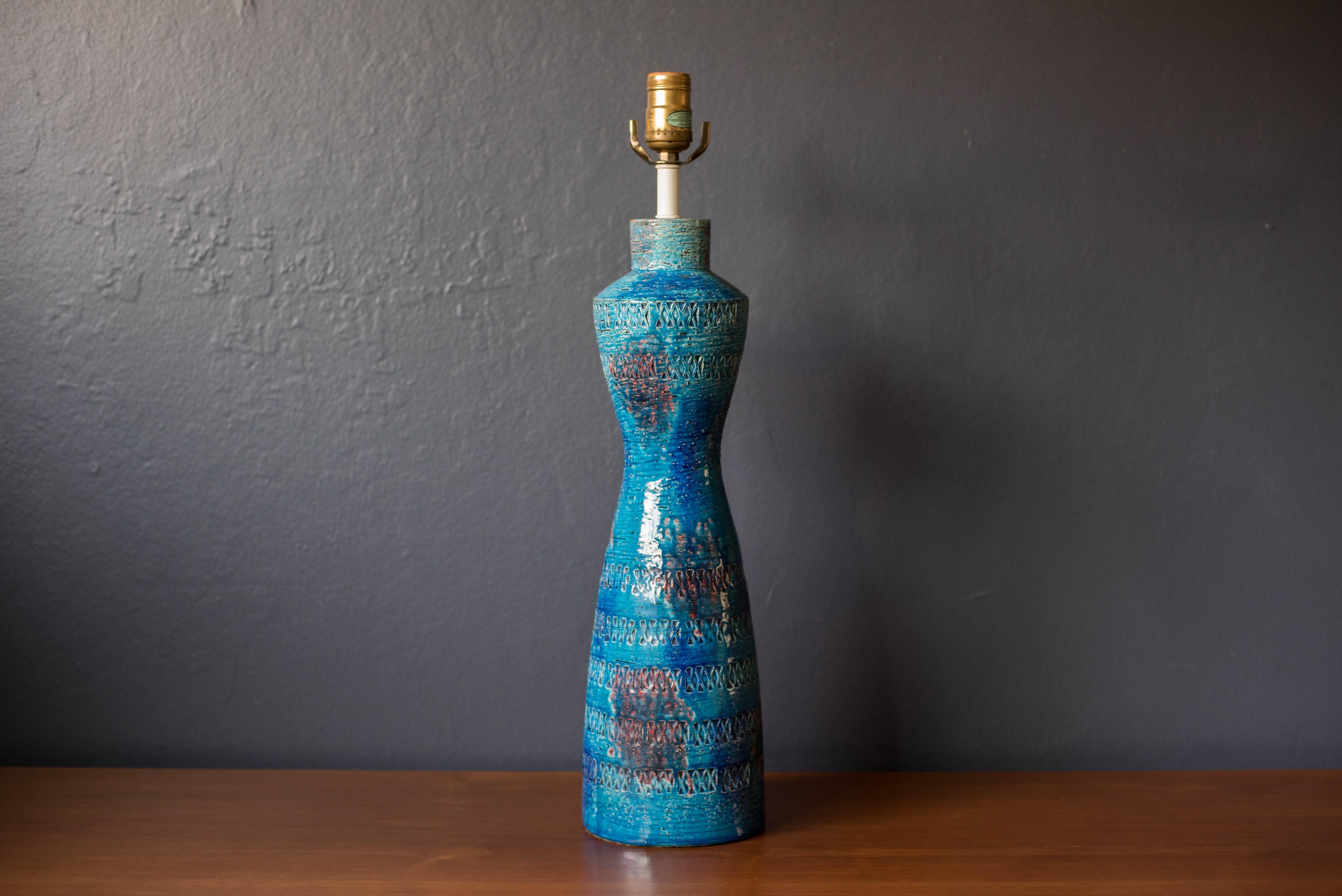 Vintage tall ceramic pottery lamp designed by Aldo Londi for Bitossi, made in Italy. This piece features a textural etched geometric design finished in a Rimini blue glaze.



Offered by Mid Century Maddist