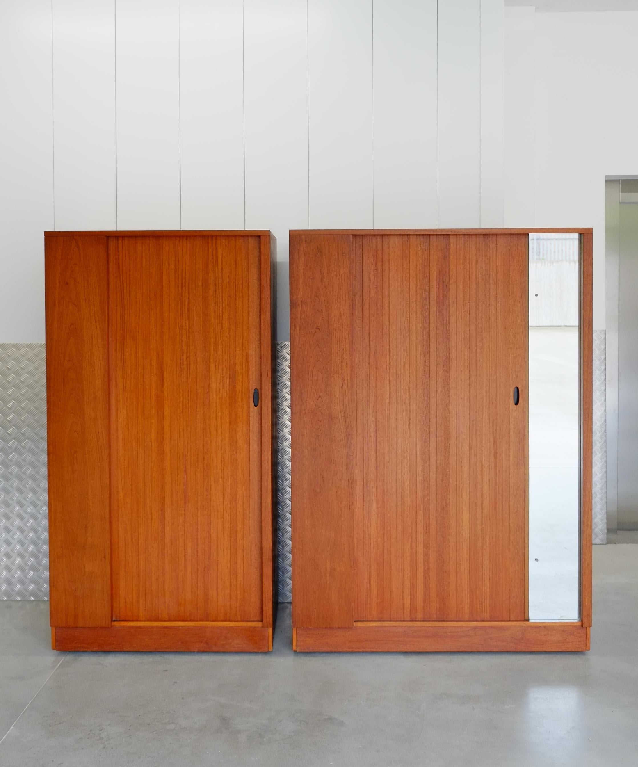 A beautiful mid century fitted wardrobe by Austinsuite. England C1960. We have a matching large wardrobe available on request. 

This piece is beautifully made with an elegant tambour door design and elegant fitted interior. The tambour door sets