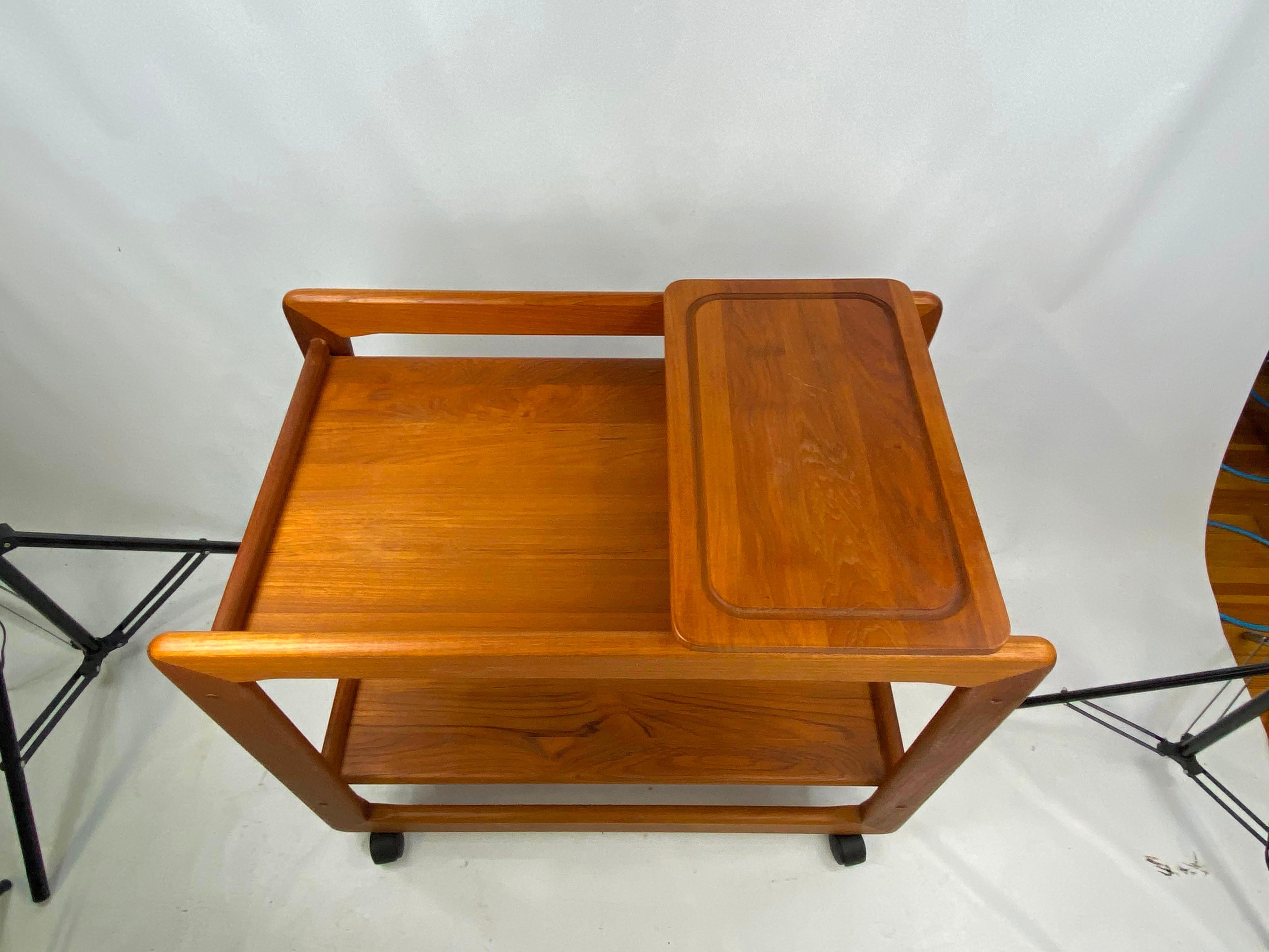 Midcentury Tarm Stole Og Møbelfabrik Danish modern teak bar cart. Very nice solid teak bar cart. Bar cart is very heavy and has a cheese bored.