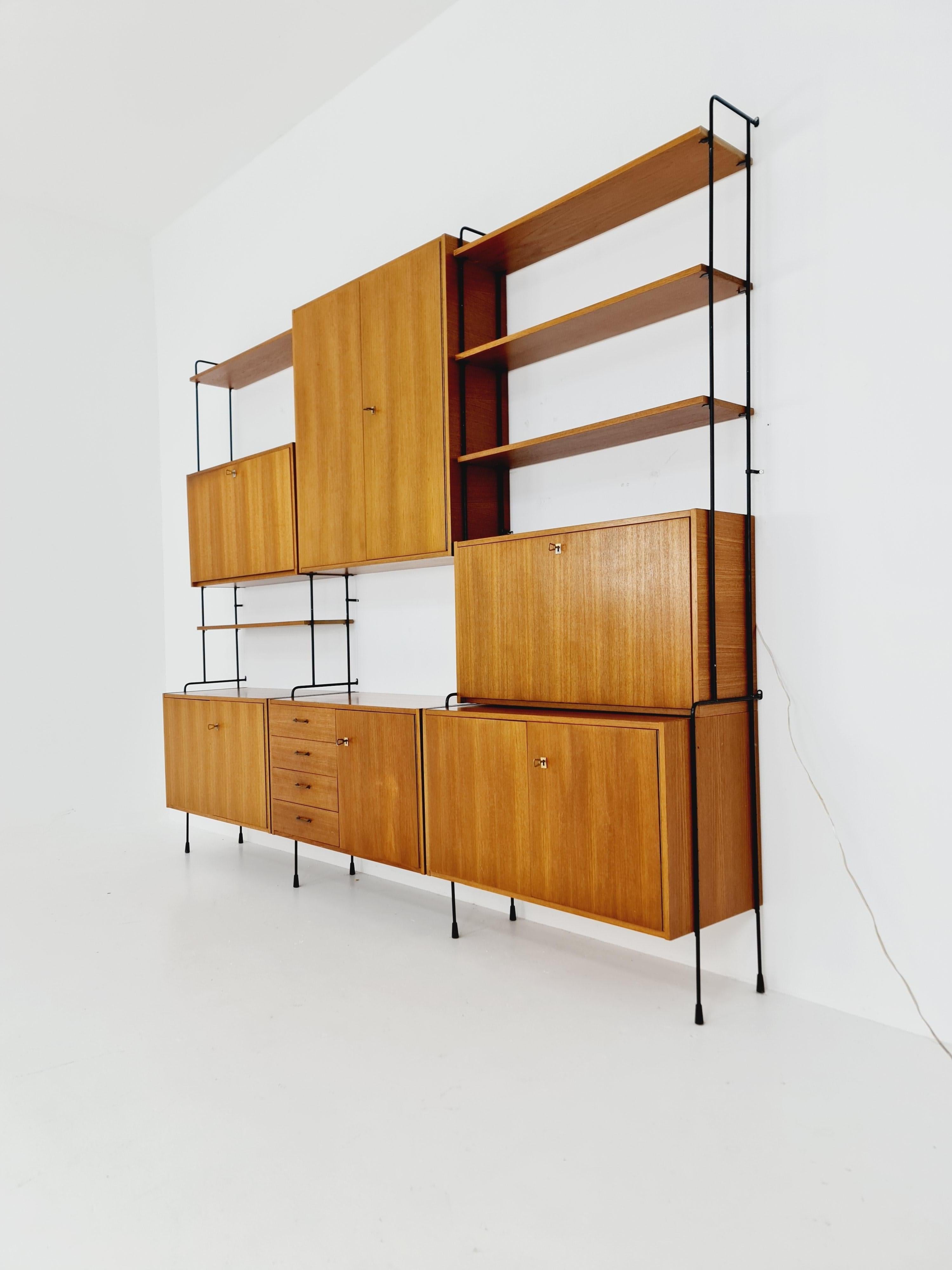 Mid century Teak 11  pieces shelving unit by Hilker for Omnia, Germany  For Sale 5