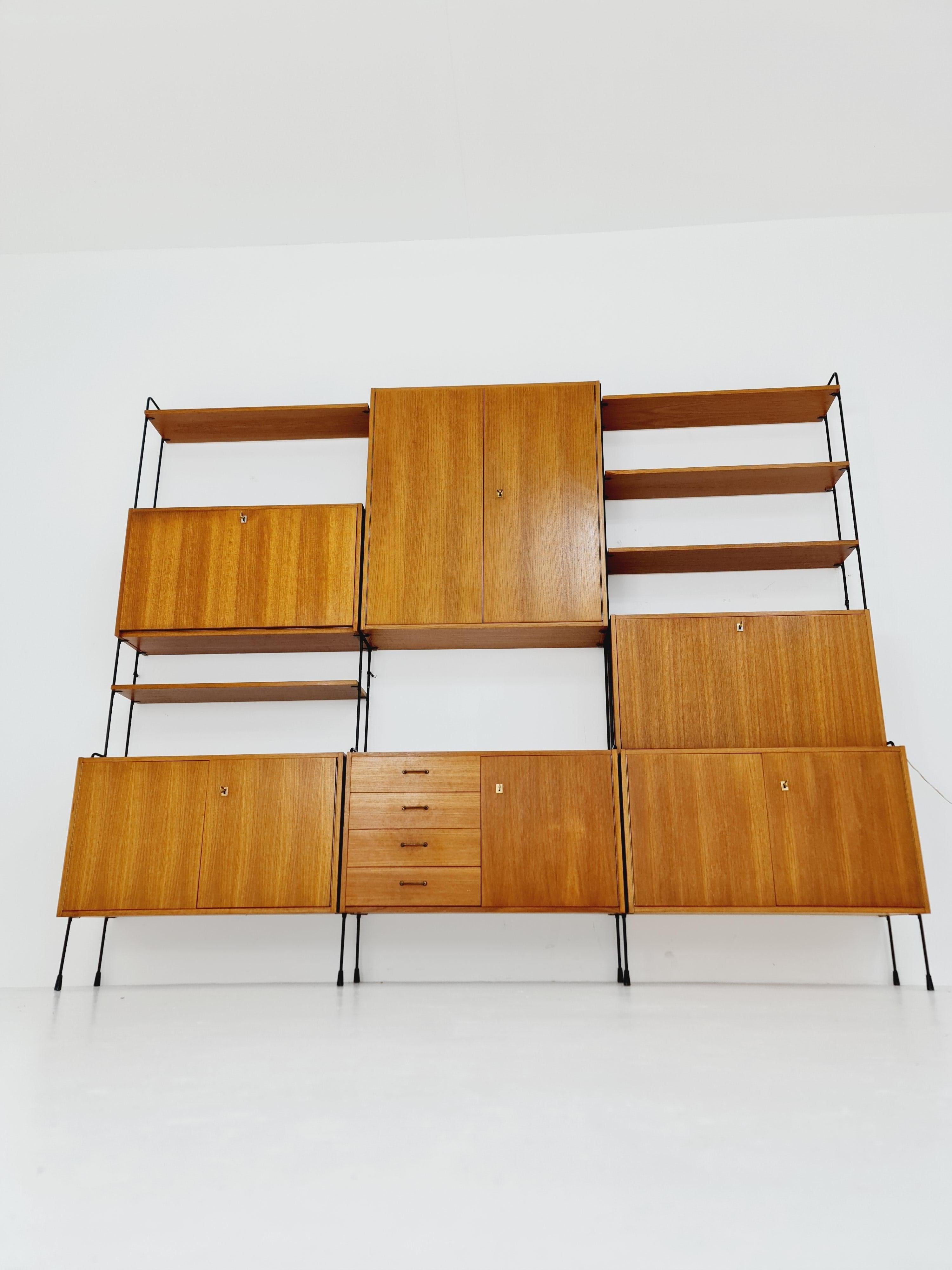 Mid century Teak 11  pieces shelving unit by Hilker for Omnia, Germany  For Sale 6