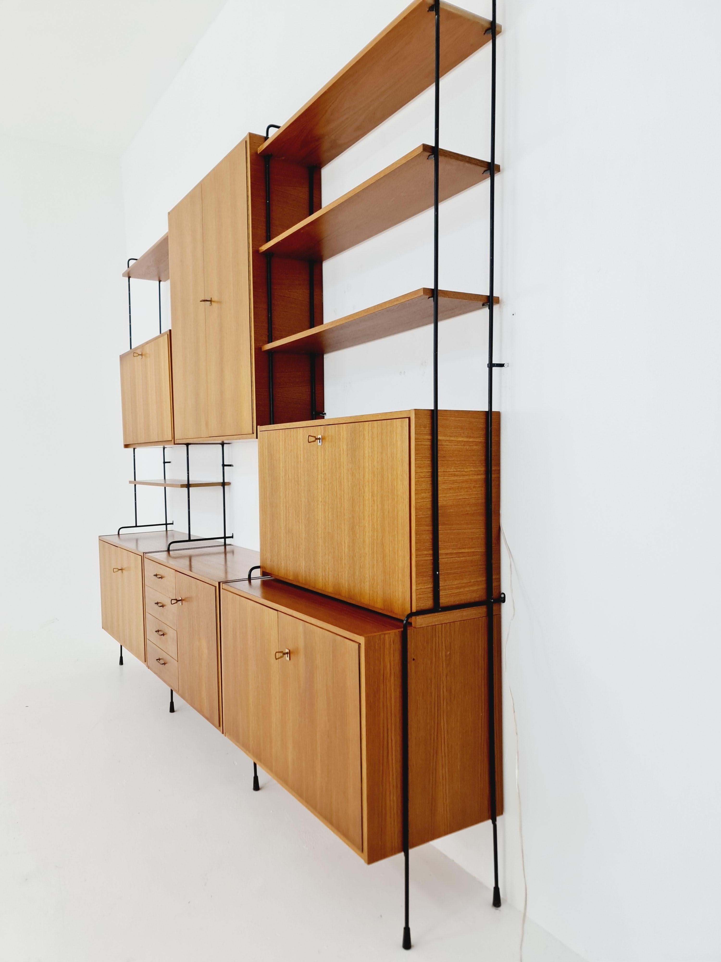 Mid century Teak 11  pieces shelving unit by Hilker for Omnia, Germany  For Sale 9