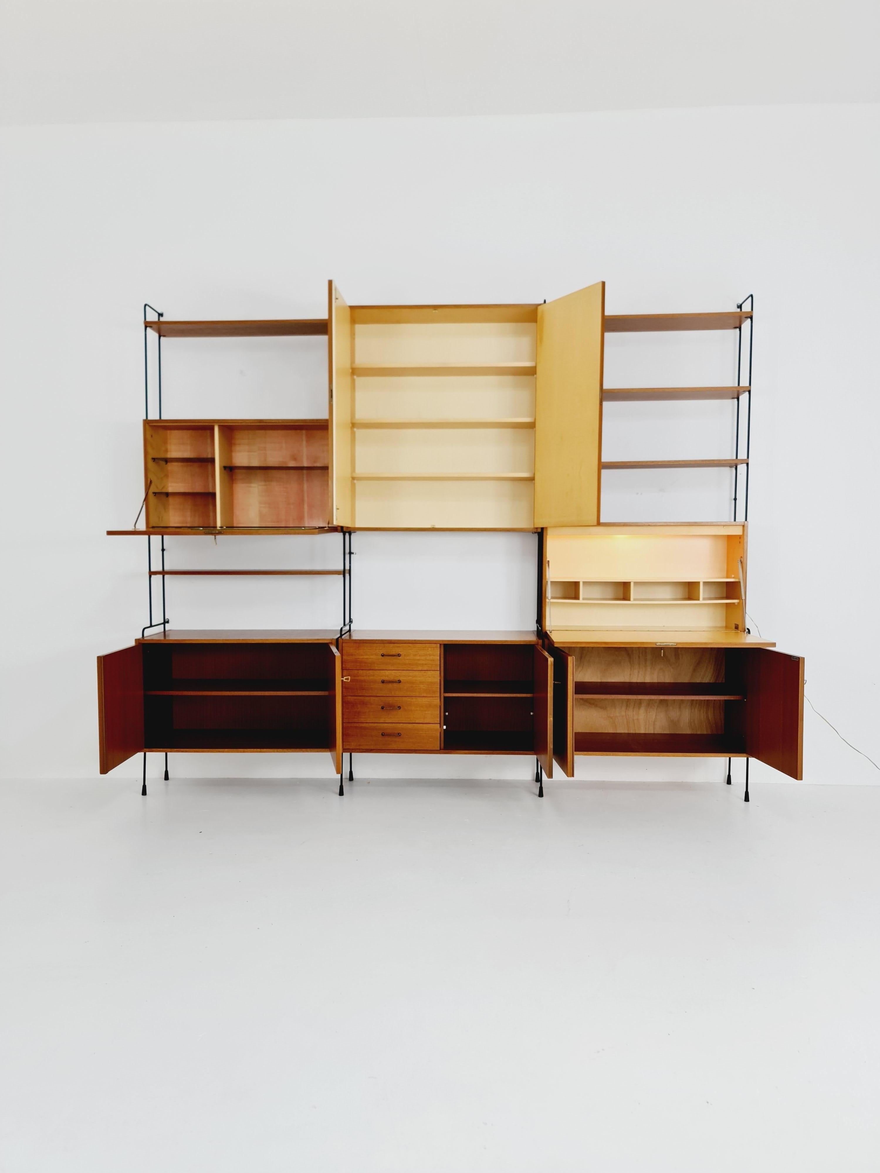 Mid century Teak 11  pieces shelving unit by Hilker for Omnia, Germany  For Sale 11