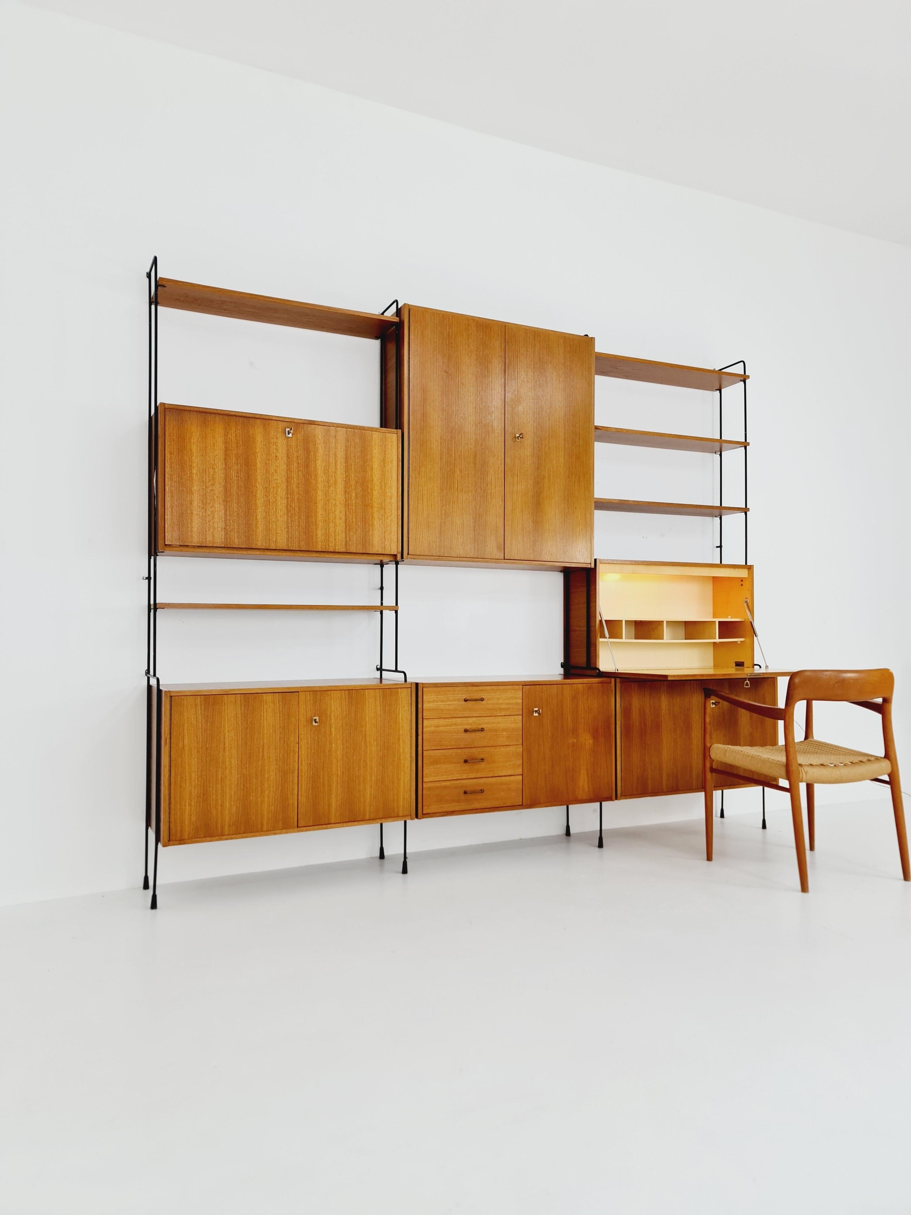 Mid-Century Modern Mid century Teak 11  pieces shelving unit by Hilker for Omnia, Germany  For Sale