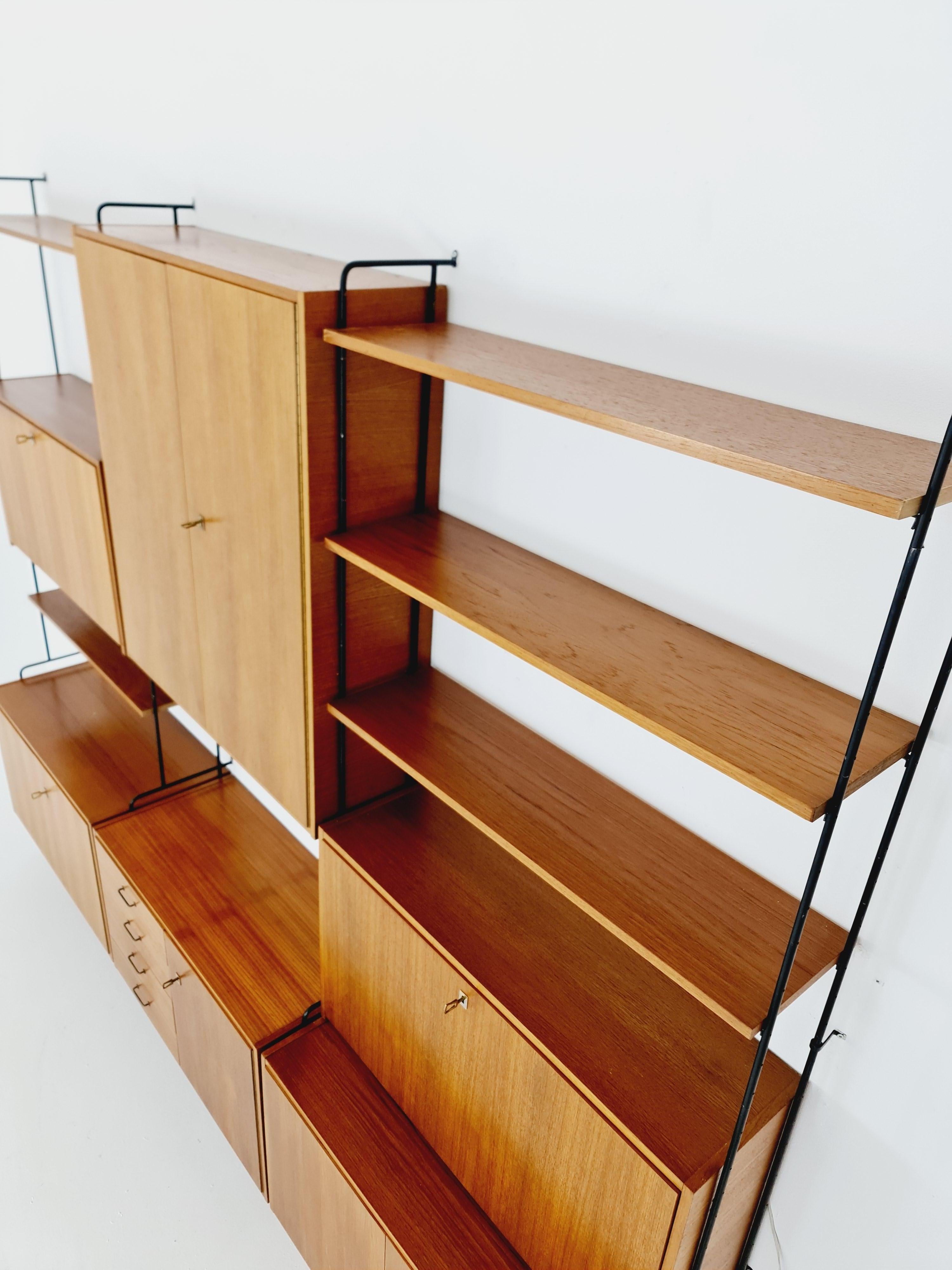 Mid century Teak 11  pieces shelving unit by Hilker for Omnia, Germany  For Sale 3