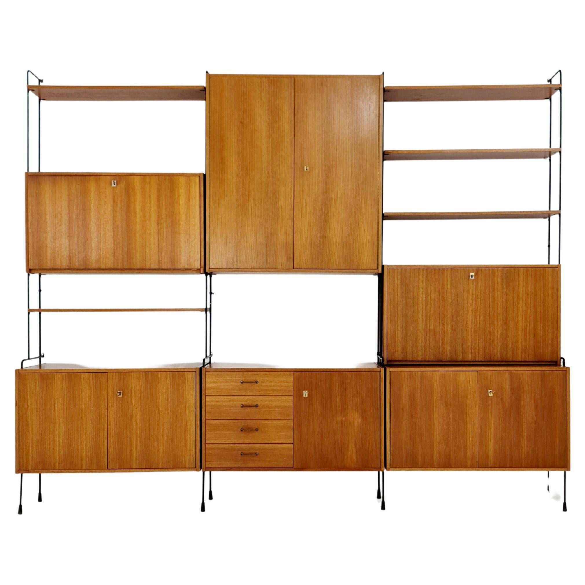 Mid century Teak 11  pieces shelving unit by Hilker for Omnia, Germany  For Sale