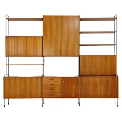 Used Mid century Teak 11  pieces shelving unit by Hilker for Omnia, Germany 