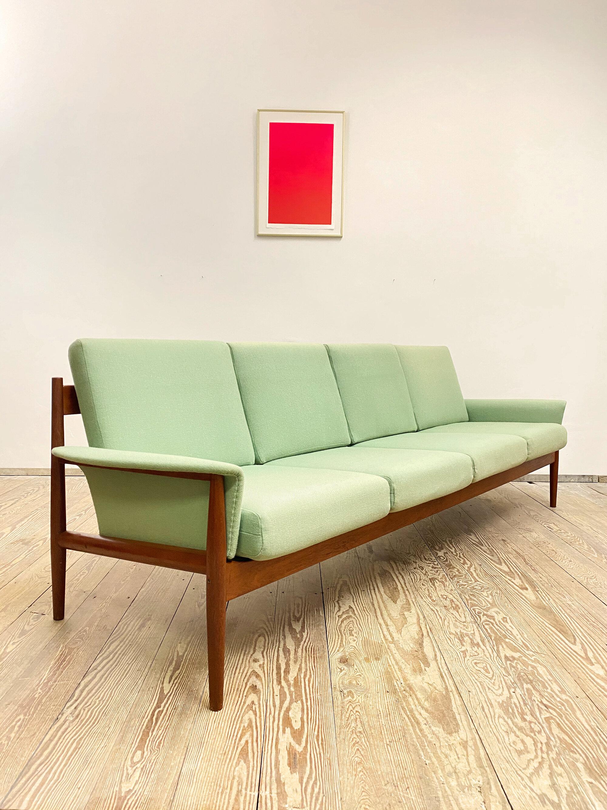 Dimensions 250 x 75 x 78 x 44 cm (W x D x H x SH) 

This shapely and comfortable sofa was designed by Danish Designer and Architect Grete Jalk for France and Son. This very rare four-seat sofa comes in a version made of solid teak wood with more