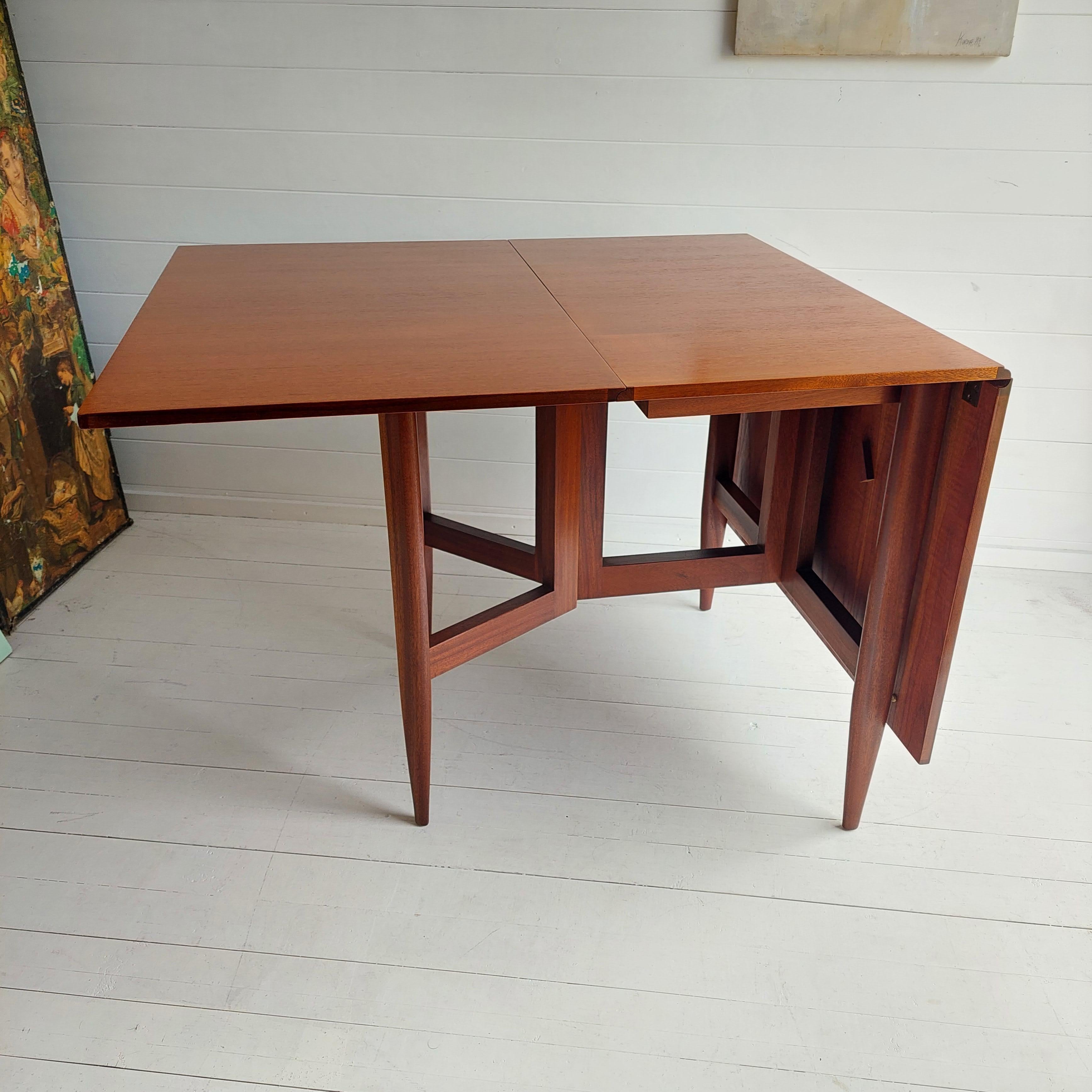 20th Century Mid Century teak and afromosia gateleg Danish dining table, George Nelson style 