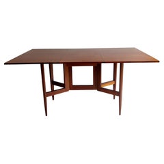 Retro Mid Century teak and afromosia gateleg Danish dining table, George Nelson style 