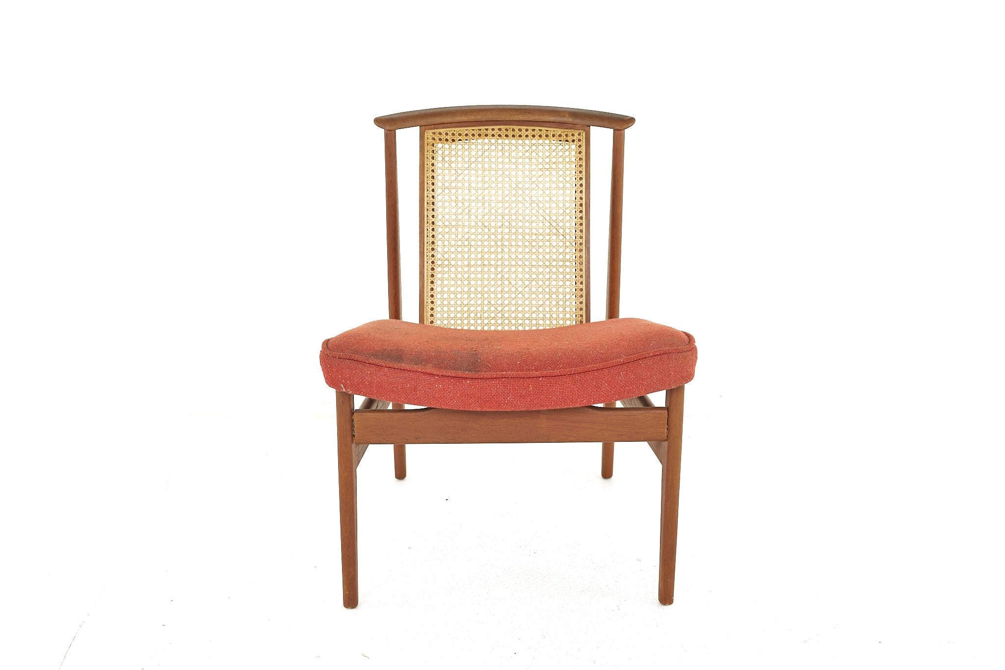 Mid Century Teak and Cane Occasional Chair

The chair measures: 22.25 wide x 25.5 deep x 30.5 high, with a seat height/chair clearance of 17 inches

Ready for new upholstery. This service is available for an additional fee.

All pieces of