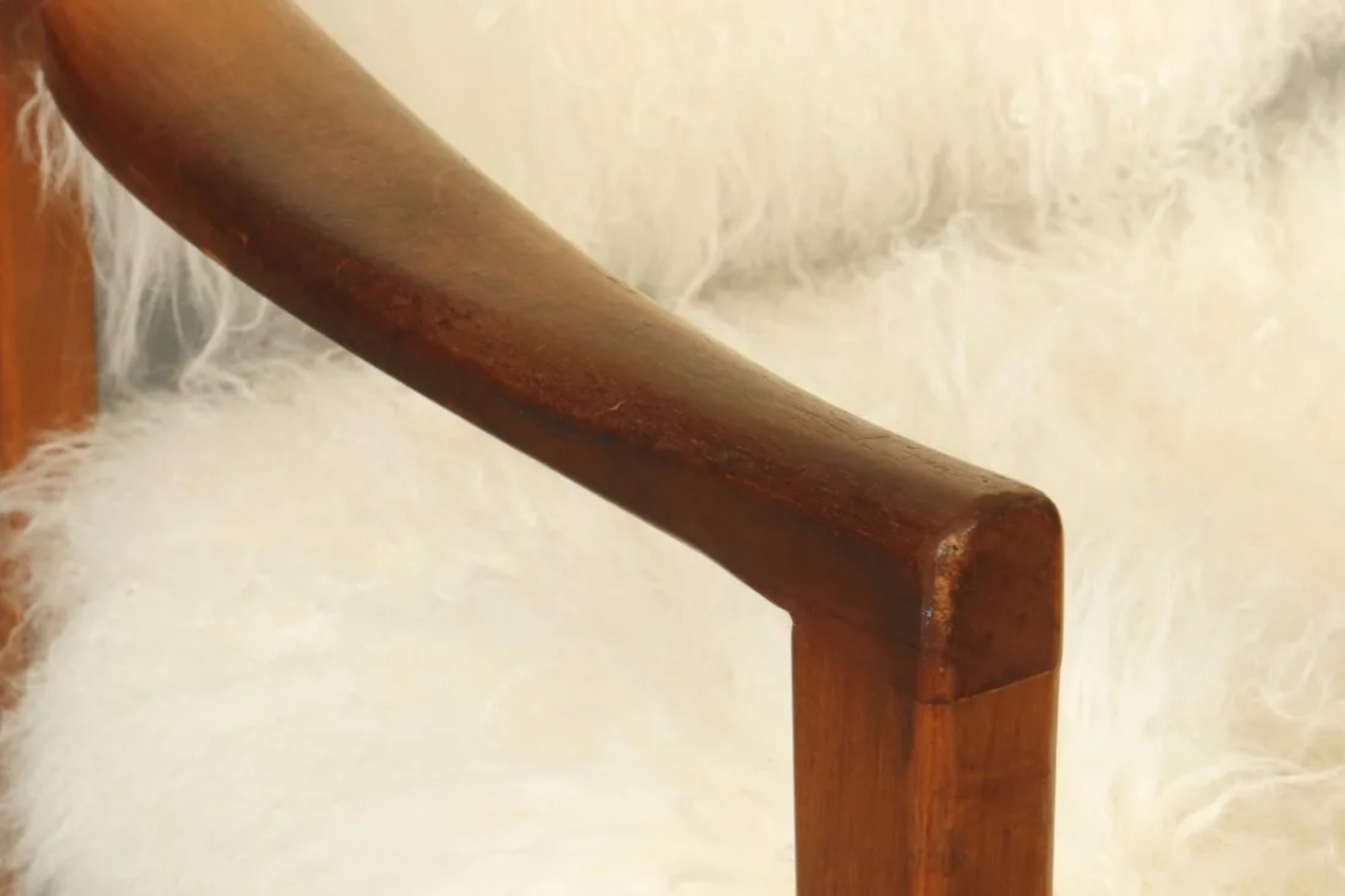 Mid-Century Teak Arm Chair With Mongolian Fur from 1970s
In very good condition considering age and use 