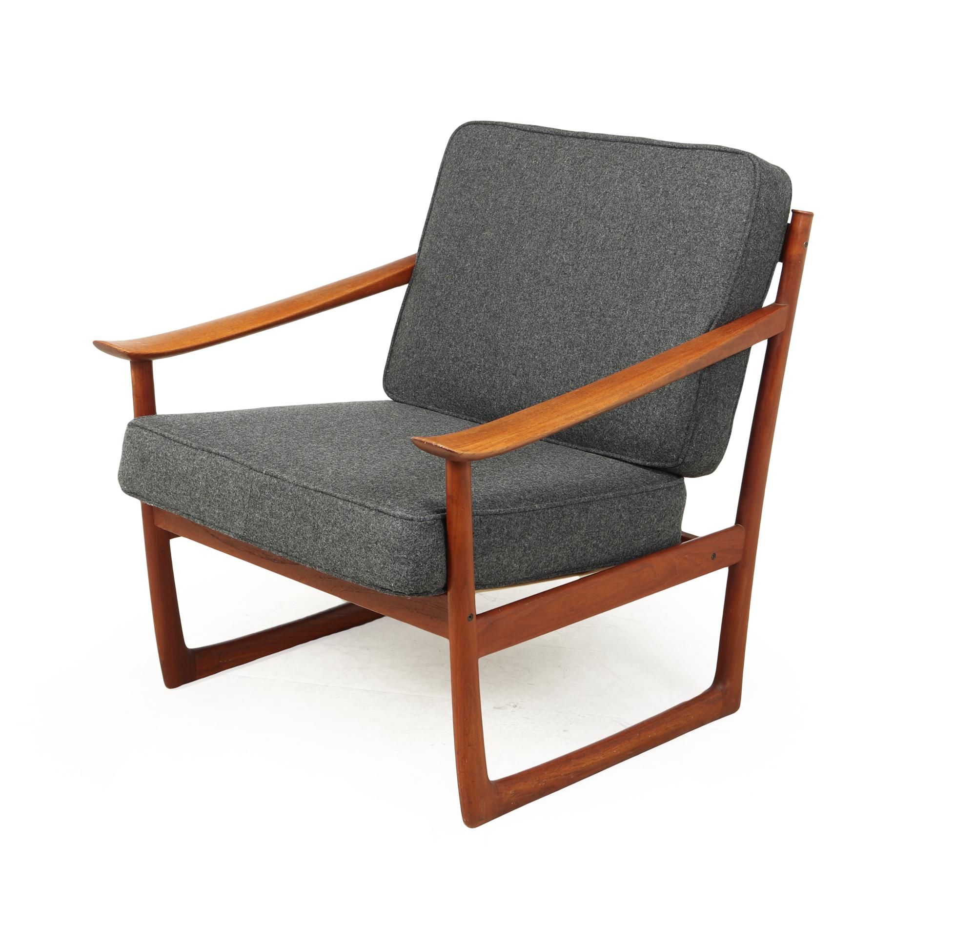 A mid century Danish lounge model 130 chair by Peter Hvidt & Orla Mølgaard, produced in Solid teak and upholstered in 100% wool fabric. Designed in 1961. This chair was produced by France and Son in the 1960’s and is in exceptional original